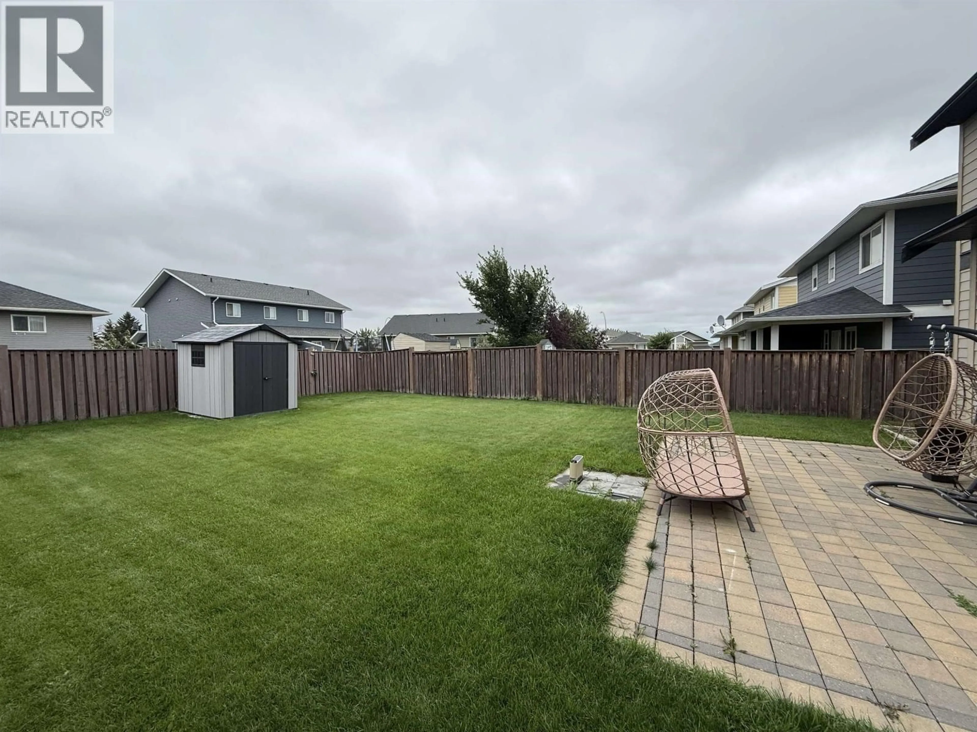 A pic from outside/outdoor area/front of a property/back of a property/a pic from drone, unknown for 8407 86 AVENUE, Fort St. John British Columbia V1J0G4