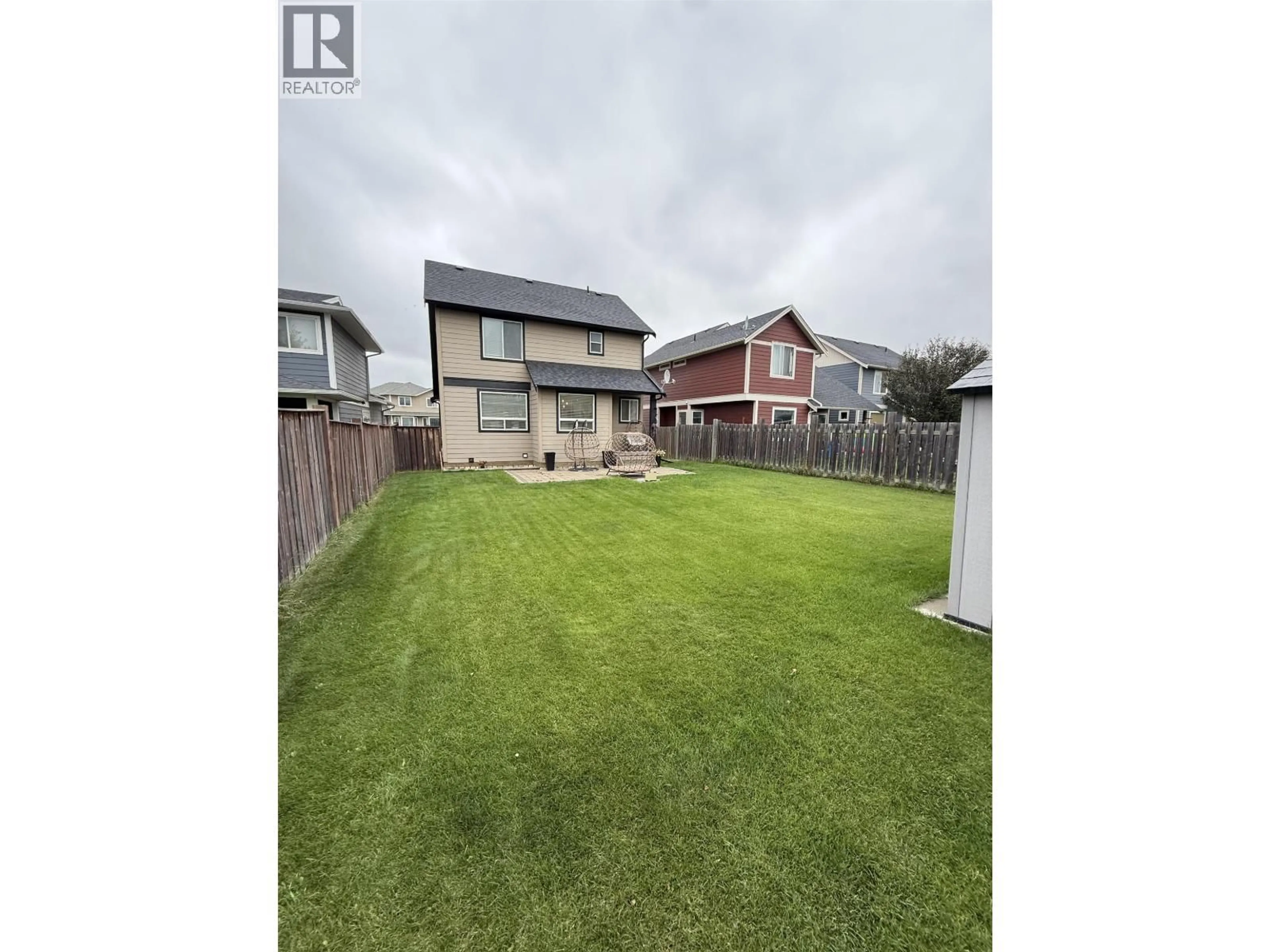 A pic from outside/outdoor area/front of a property/back of a property/a pic from drone, street for 8407 86 AVENUE, Fort St. John British Columbia V1J0G4