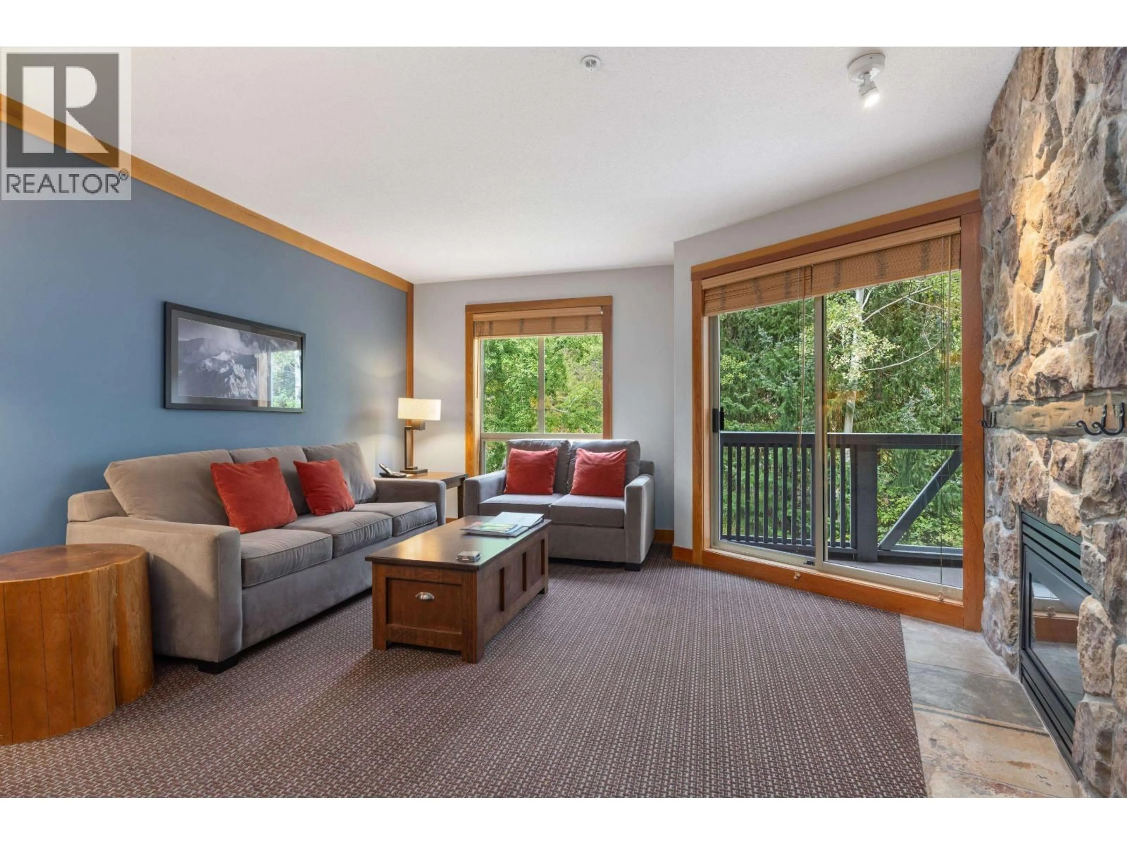 Living room with furniture, wood/laminate floor for 432A - 2036 LONDON LANE, Whistler British Columbia V8E0N7