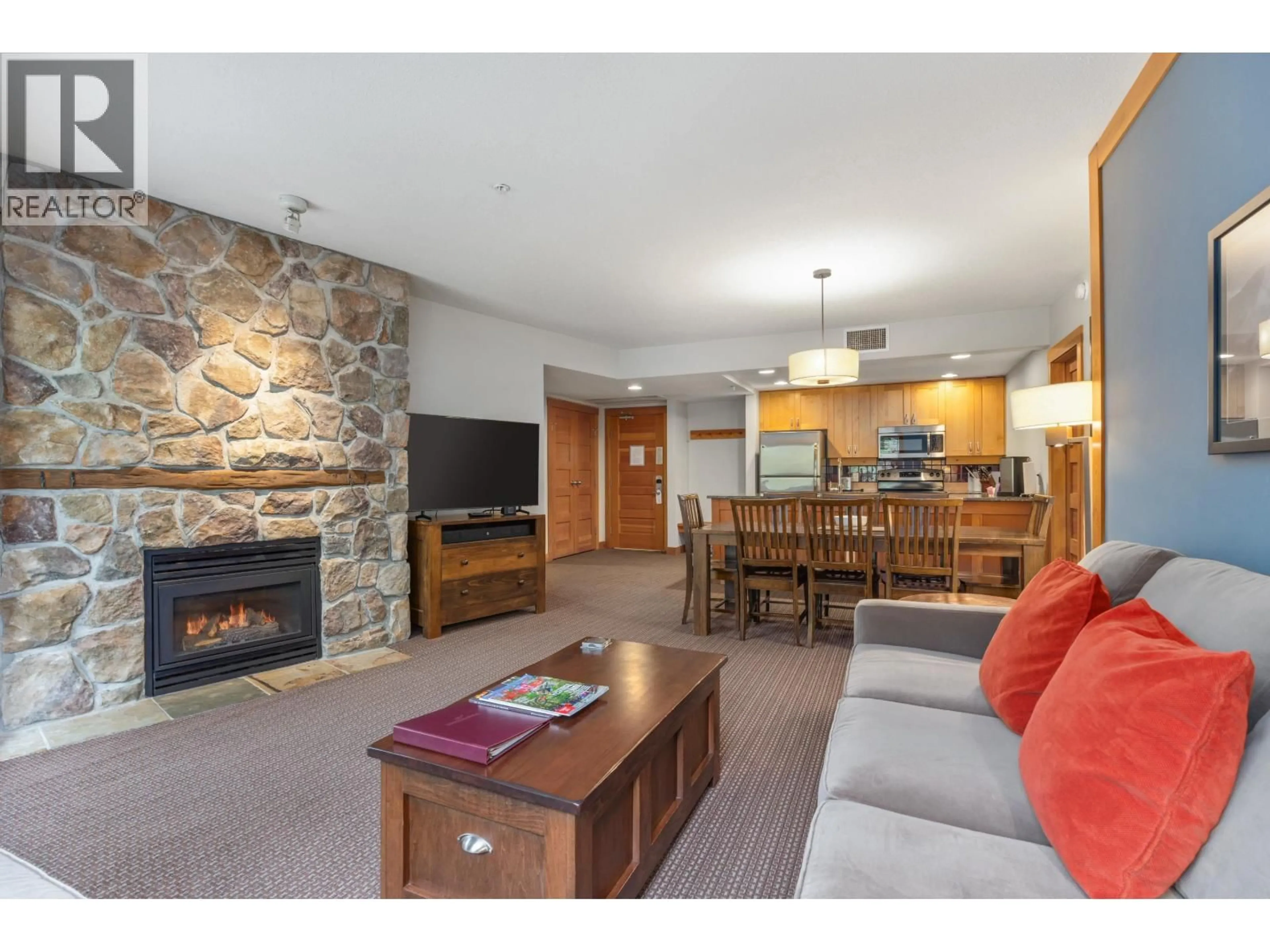 Living room with furniture, wood/laminate floor for 432A - 2036 LONDON LANE, Whistler British Columbia V8E0N7