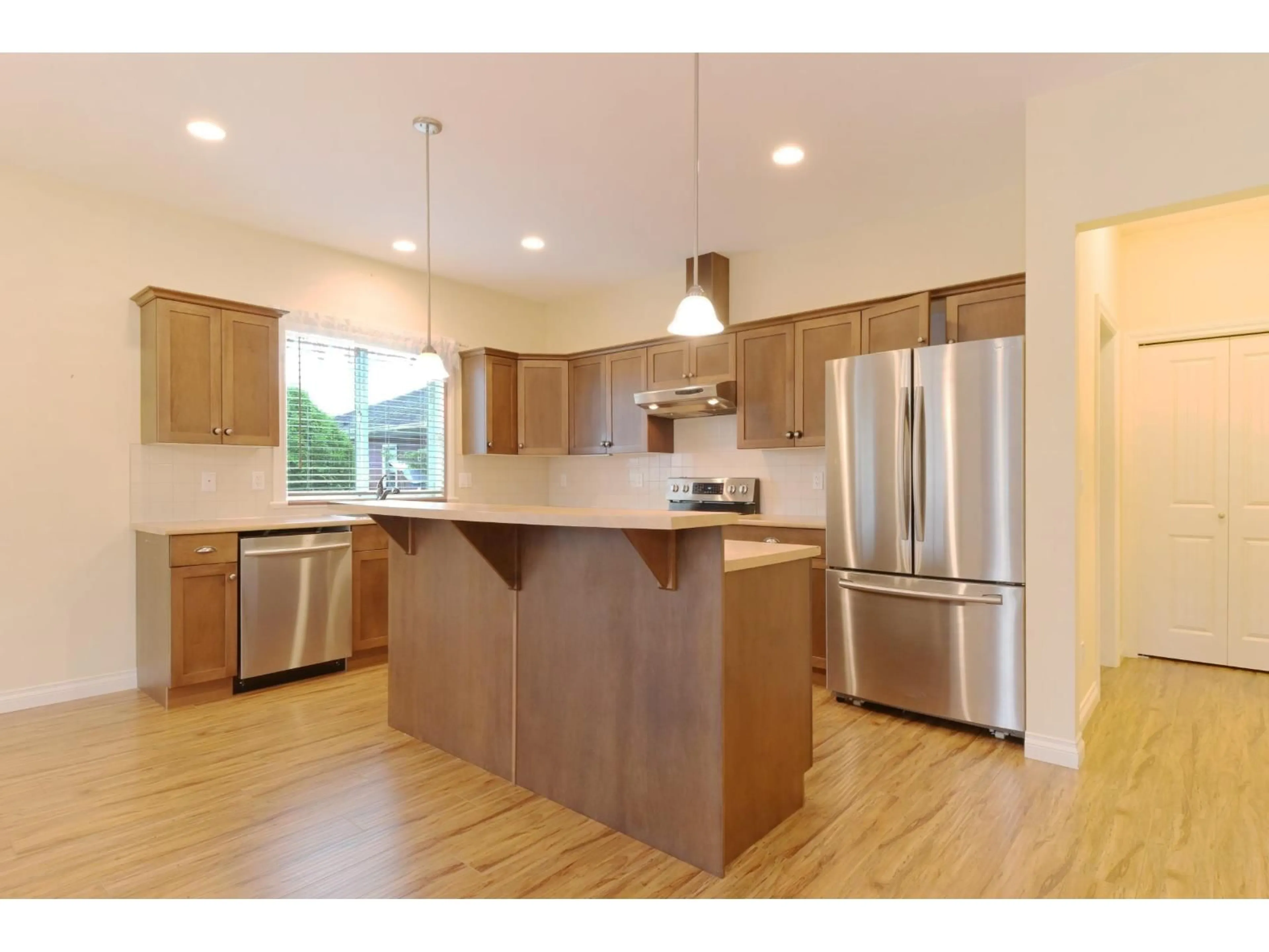 Open concept kitchen, wood/laminate floor for 66 - 7600 CHILLIWACK RIVER ROAD, Chilliwack British Columbia V2R3Z6