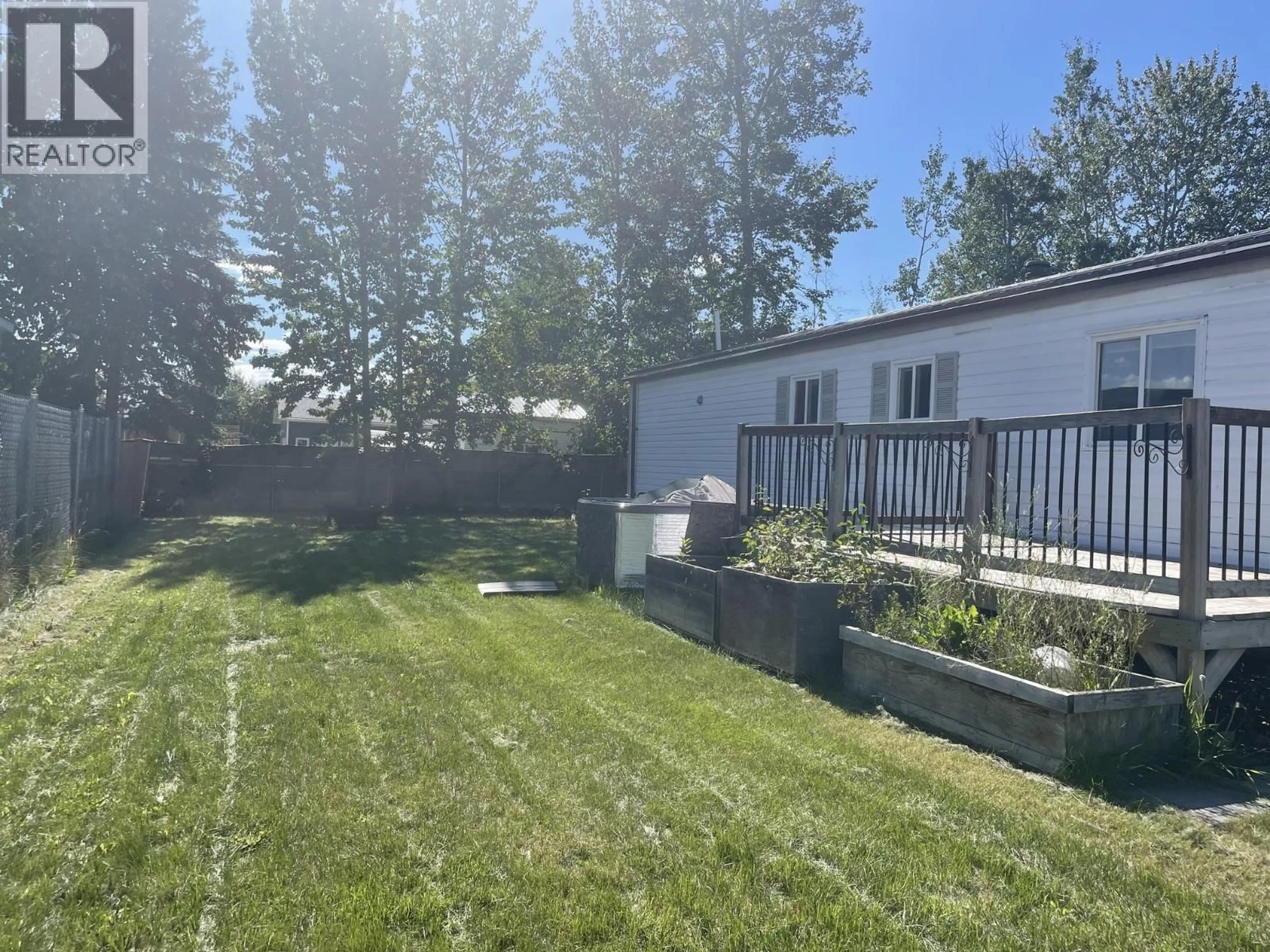 A pic from outside/outdoor area/front of a property/back of a property/a pic from drone, mountain view for 3907 POPLAR AVENUE, Fort Nelson British Columbia V0C1R0