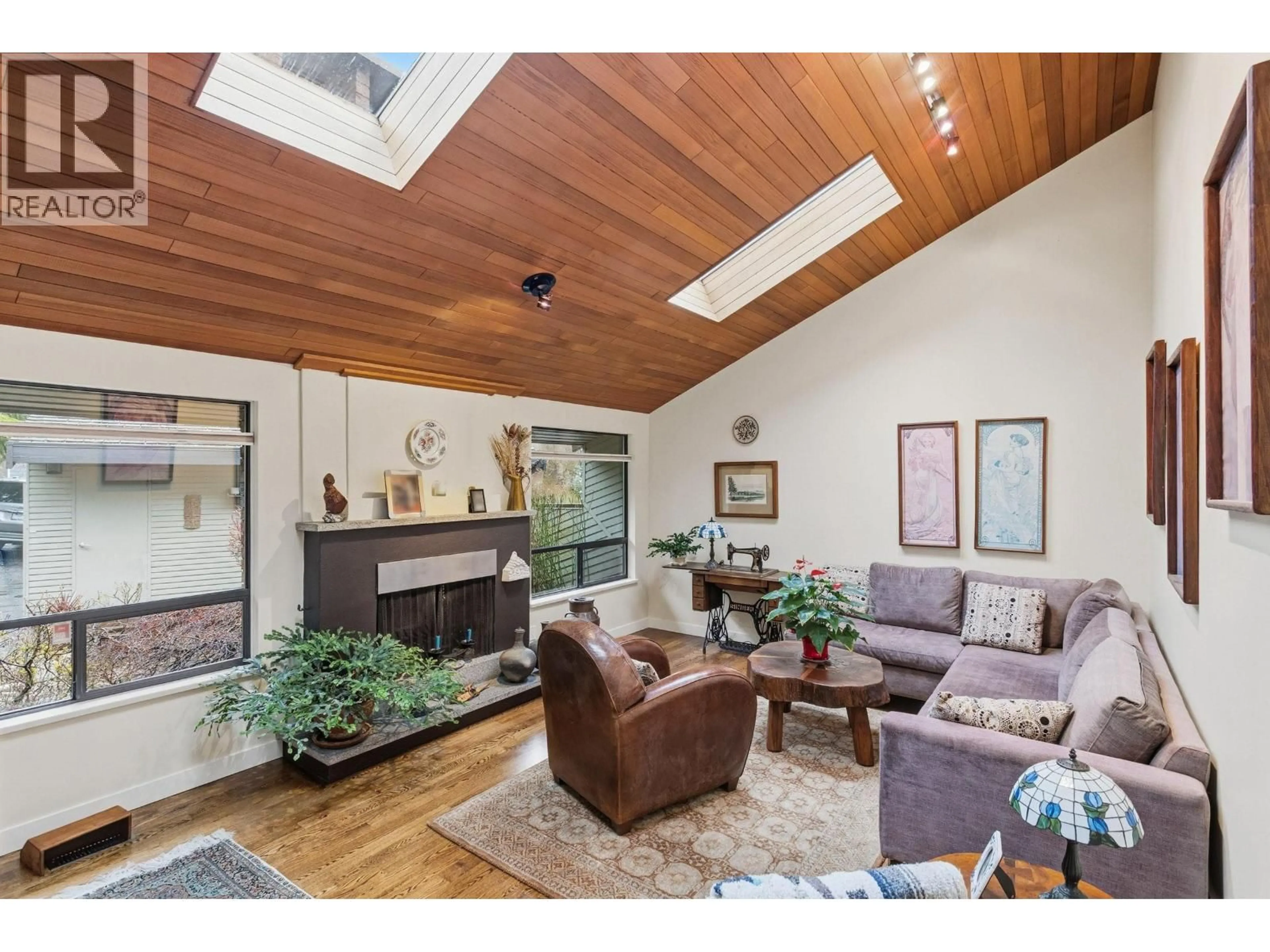 Living room with furniture, wood/laminate floor for 5639 WHITE PINE LANE, North Vancouver British Columbia V7R4S1