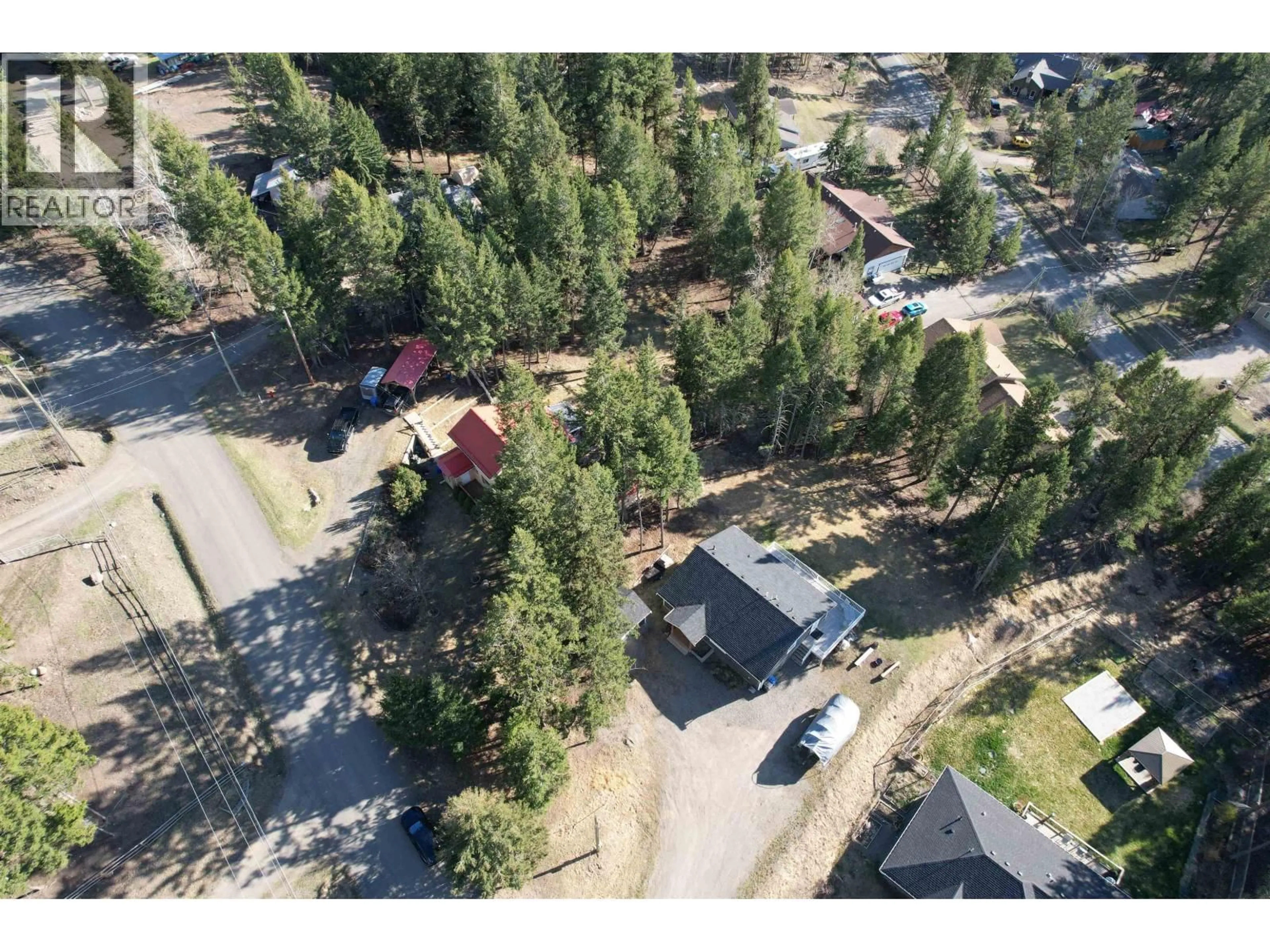 A pic from outside/outdoor area/front of a property/back of a property/a pic from drone, unknown for 4942 KYLLO ROAD, 108 Mile Ranch British Columbia V0K2Z0