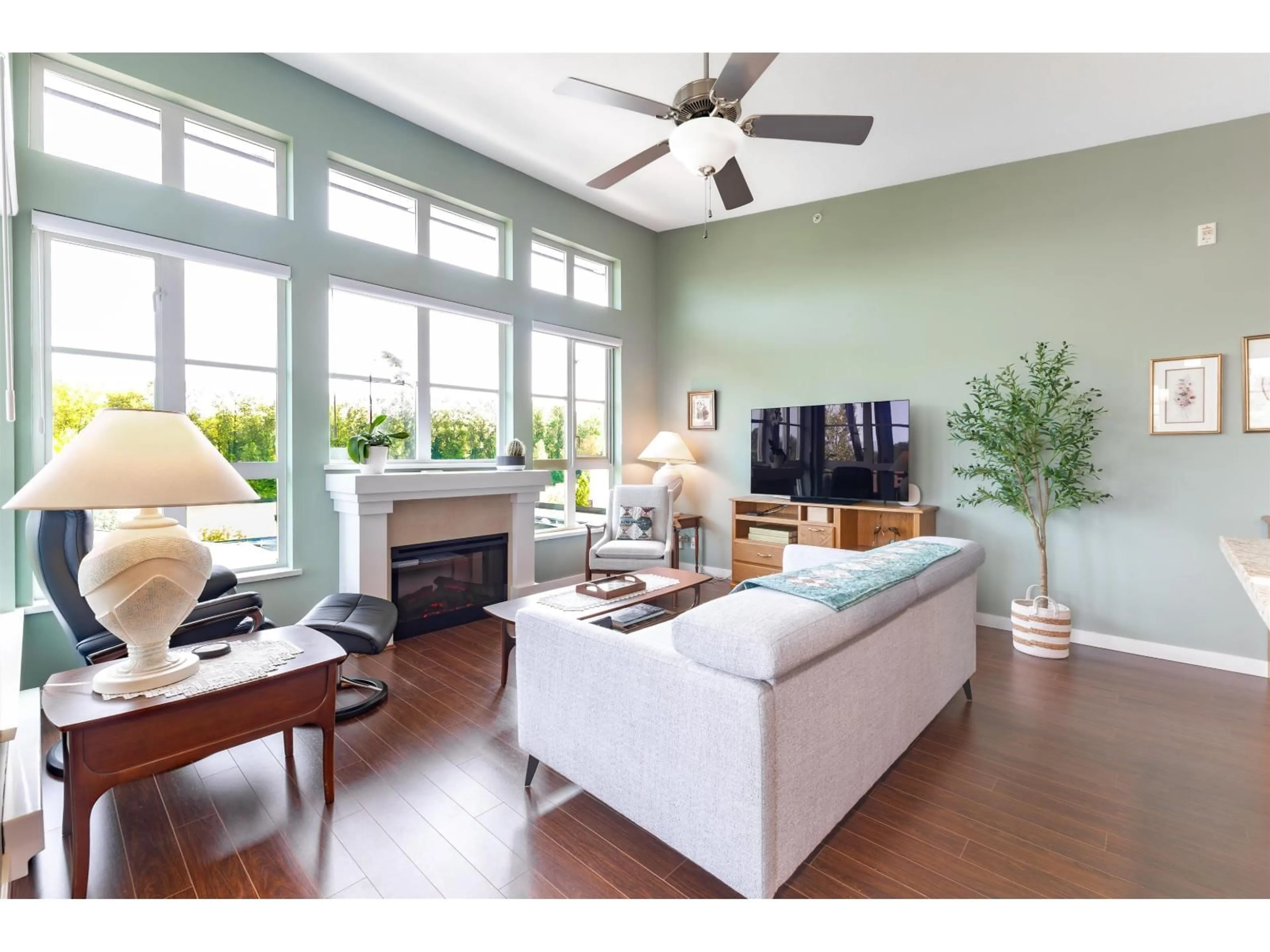 Living room with furniture, wood/laminate floor for 416 - 23215 BILLY BROWN ROAD, Langley British Columbia V1M0B7