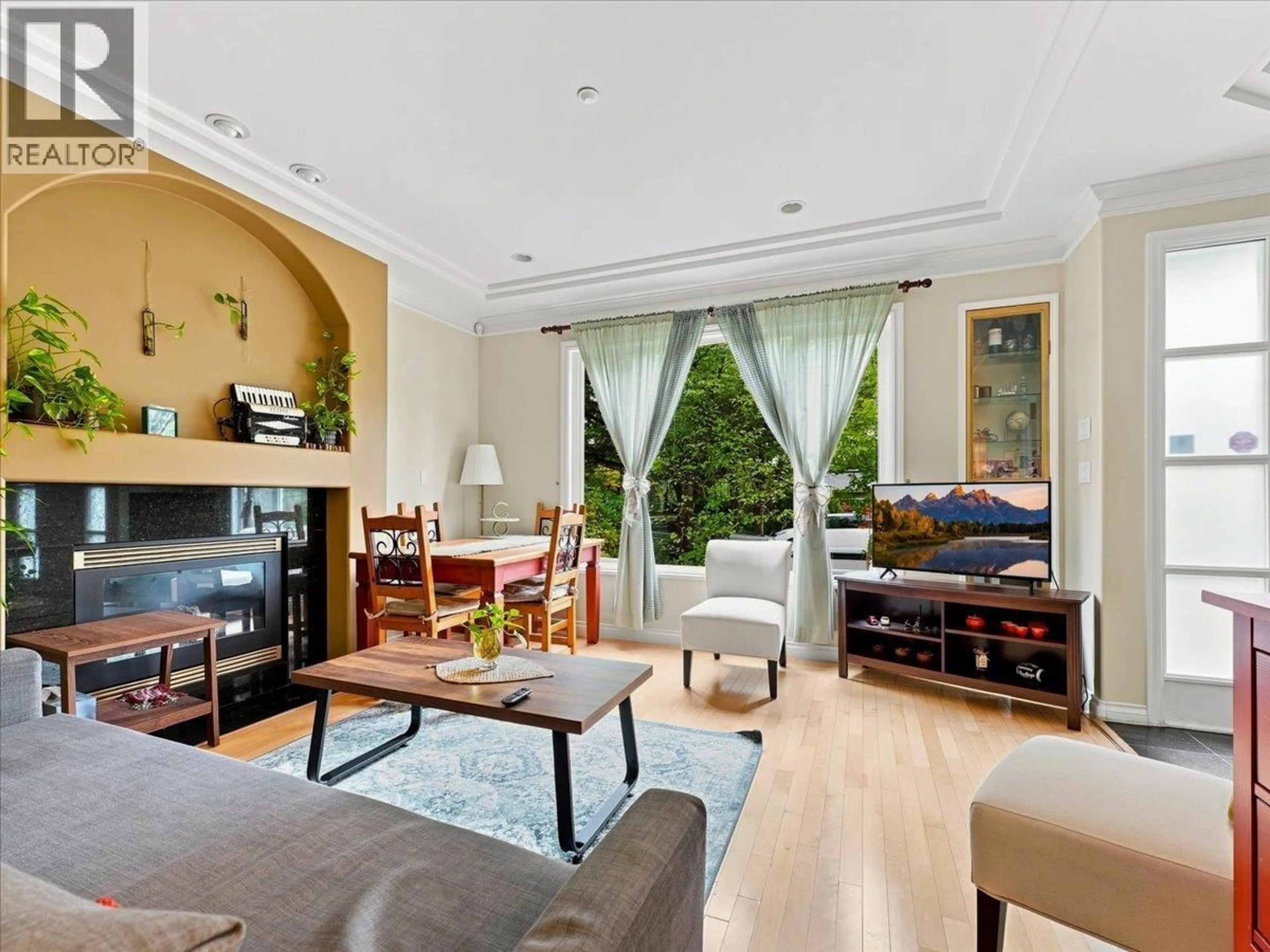 Living room with furniture, wood/laminate floor for 2579 45TH AVENUE, Vancouver British Columbia V6N3K9