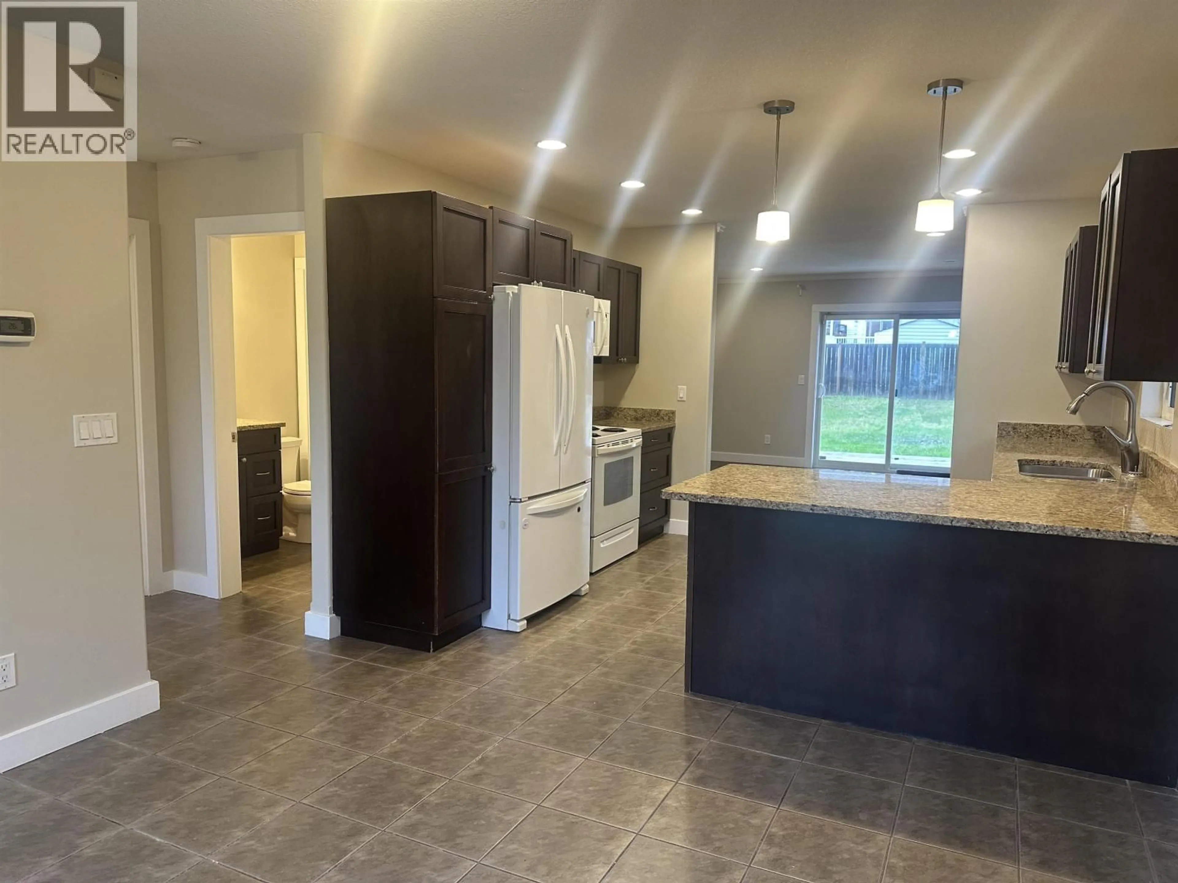 Open concept kitchen, ceramic/tile floor for 11309 89A STREET, Fort St. John British Columbia V1J0E5