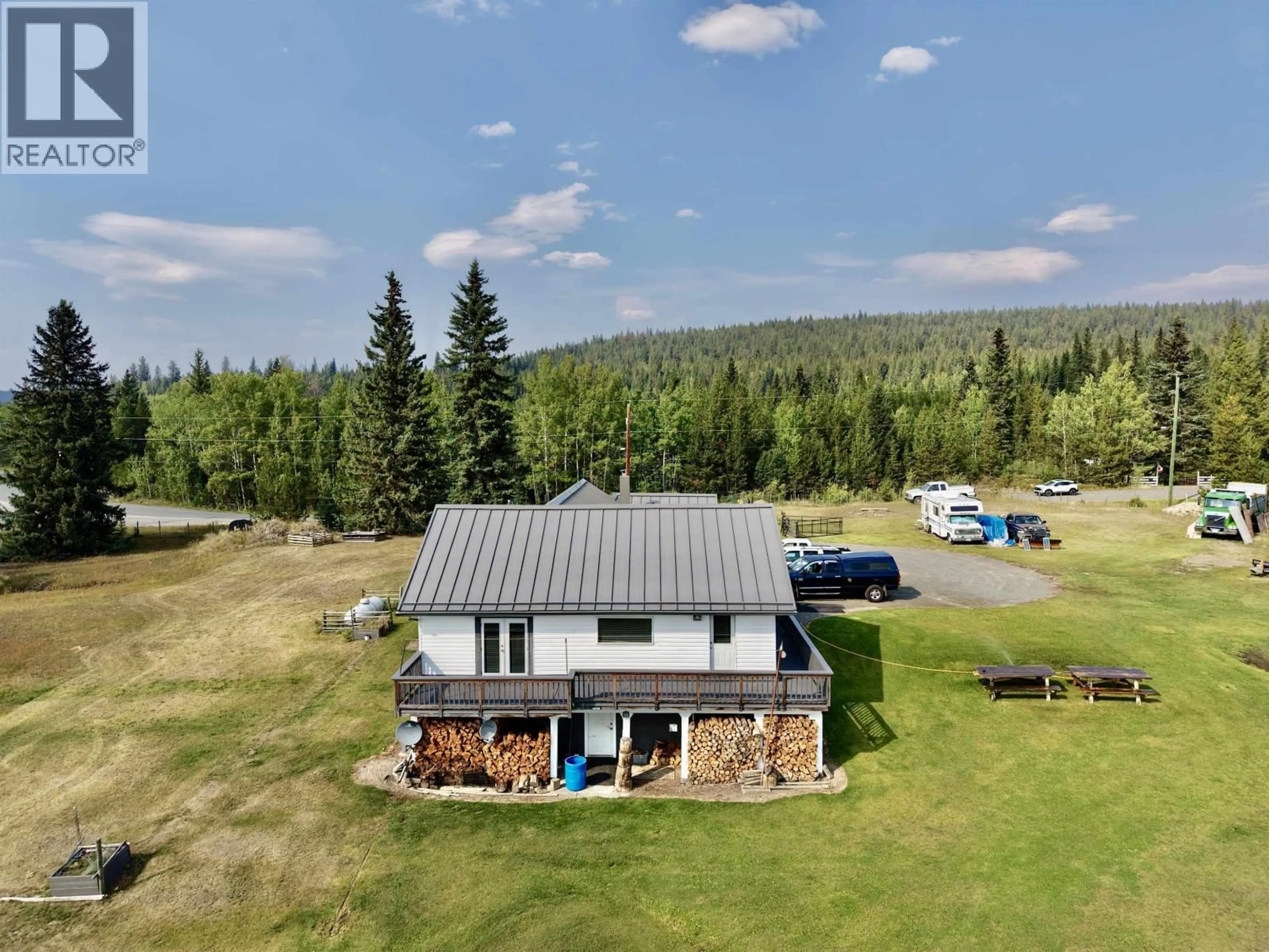 A pic from outside/outdoor area/front of a property/back of a property/a pic from drone, mountain view for 6630 FAWN CREEK ROAD, 100 Mile House British Columbia V0K2E0