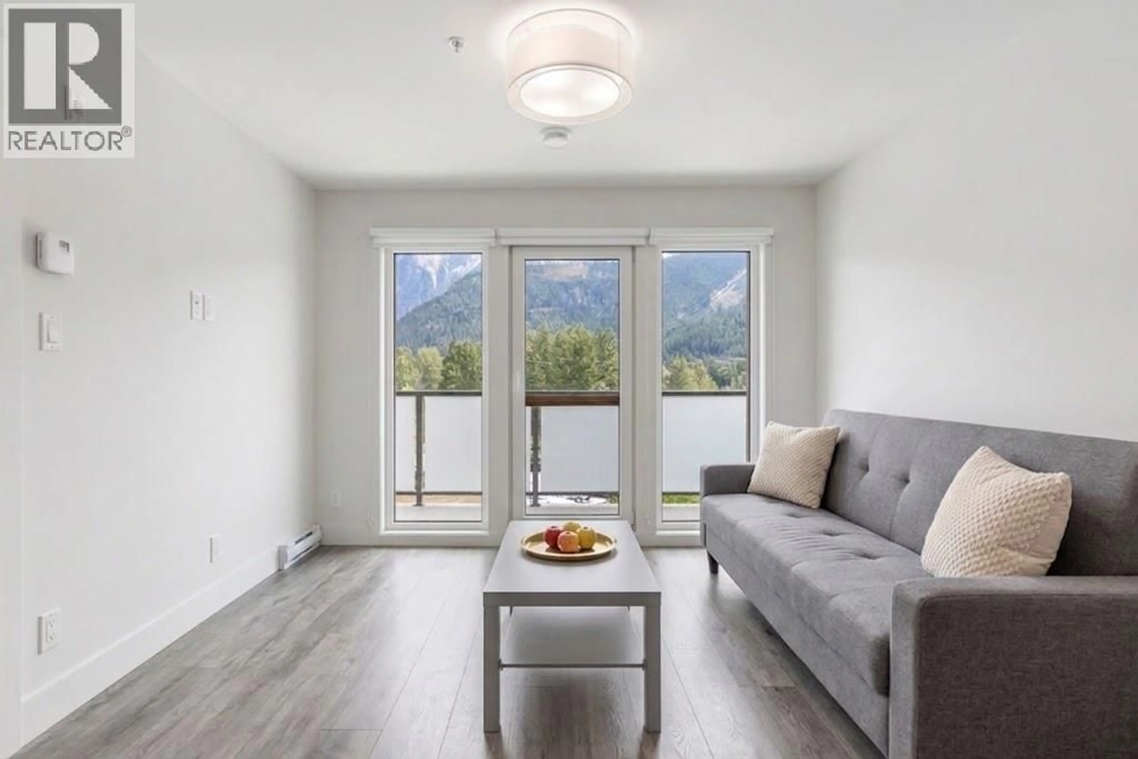 Living room with furniture, wood/laminate floor for 314 - 7350 CRABAPPLE COURT, Pemberton British Columbia V0N2L1