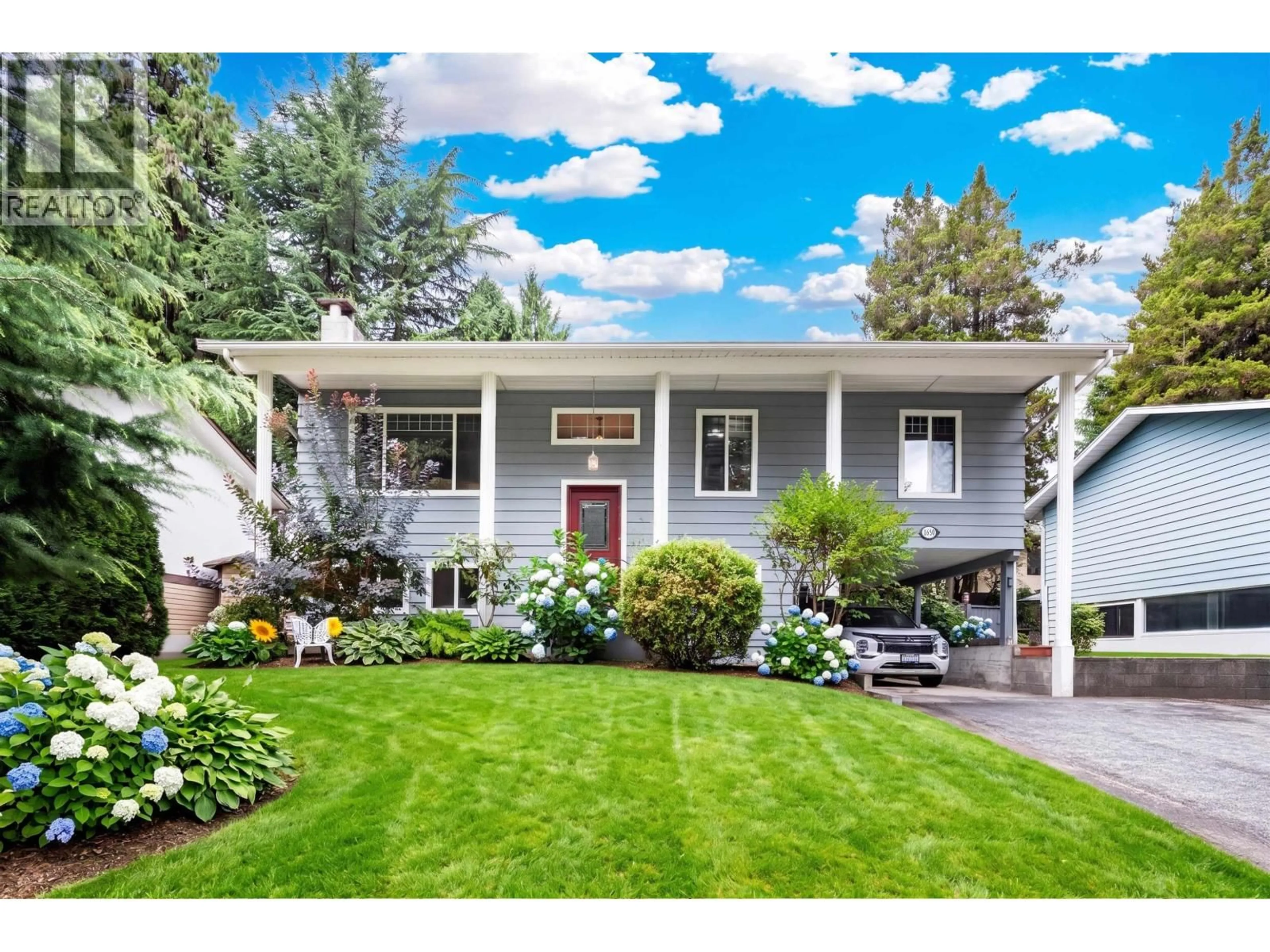 Home with vinyl exterior material, street for 1650 CONNAUGHT DRIVE, Port Coquitlam British Columbia V3C4G8