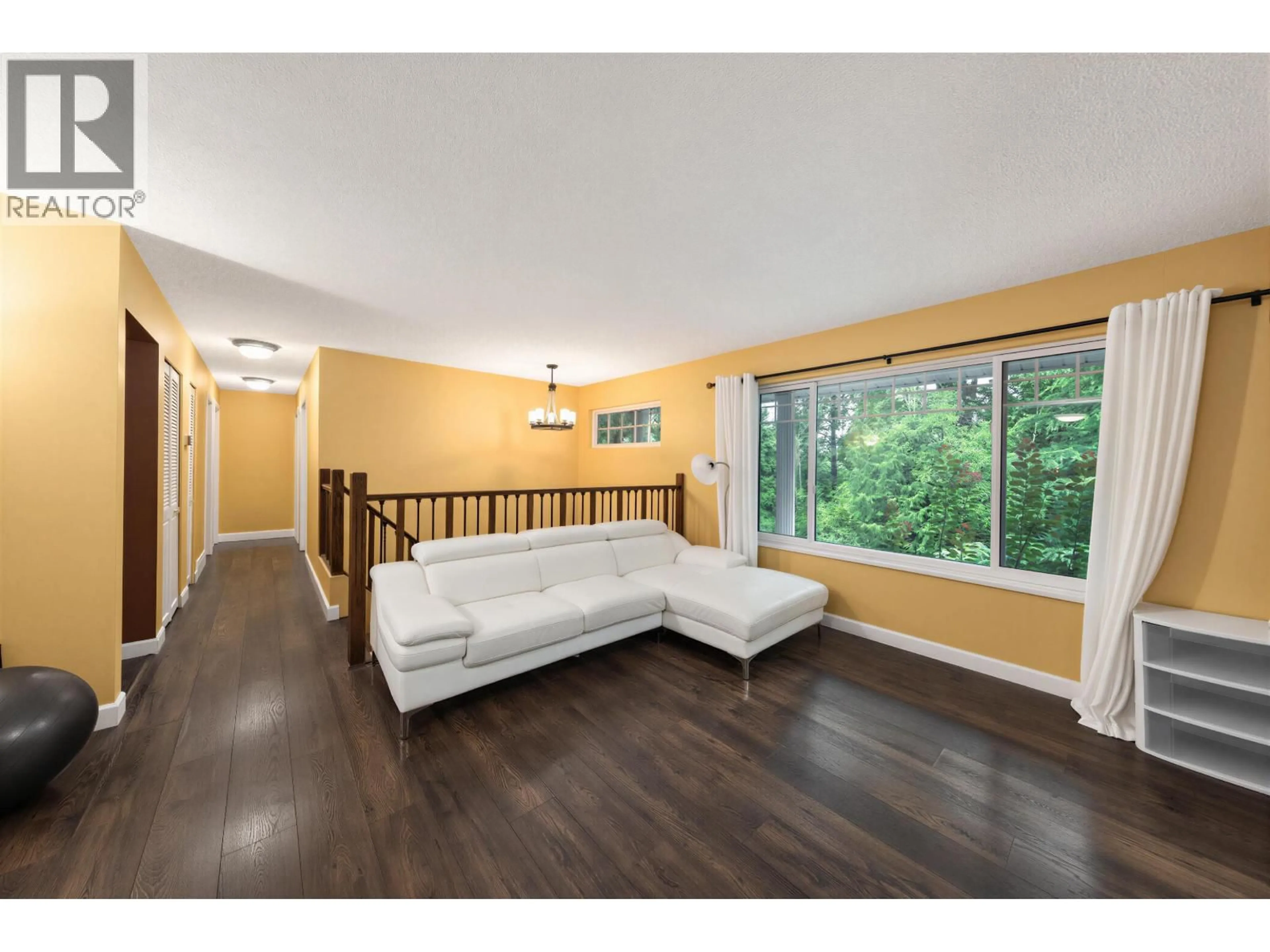 Living room with furniture, wood/laminate floor for 1650 CONNAUGHT DRIVE, Port Coquitlam British Columbia V3C4G8