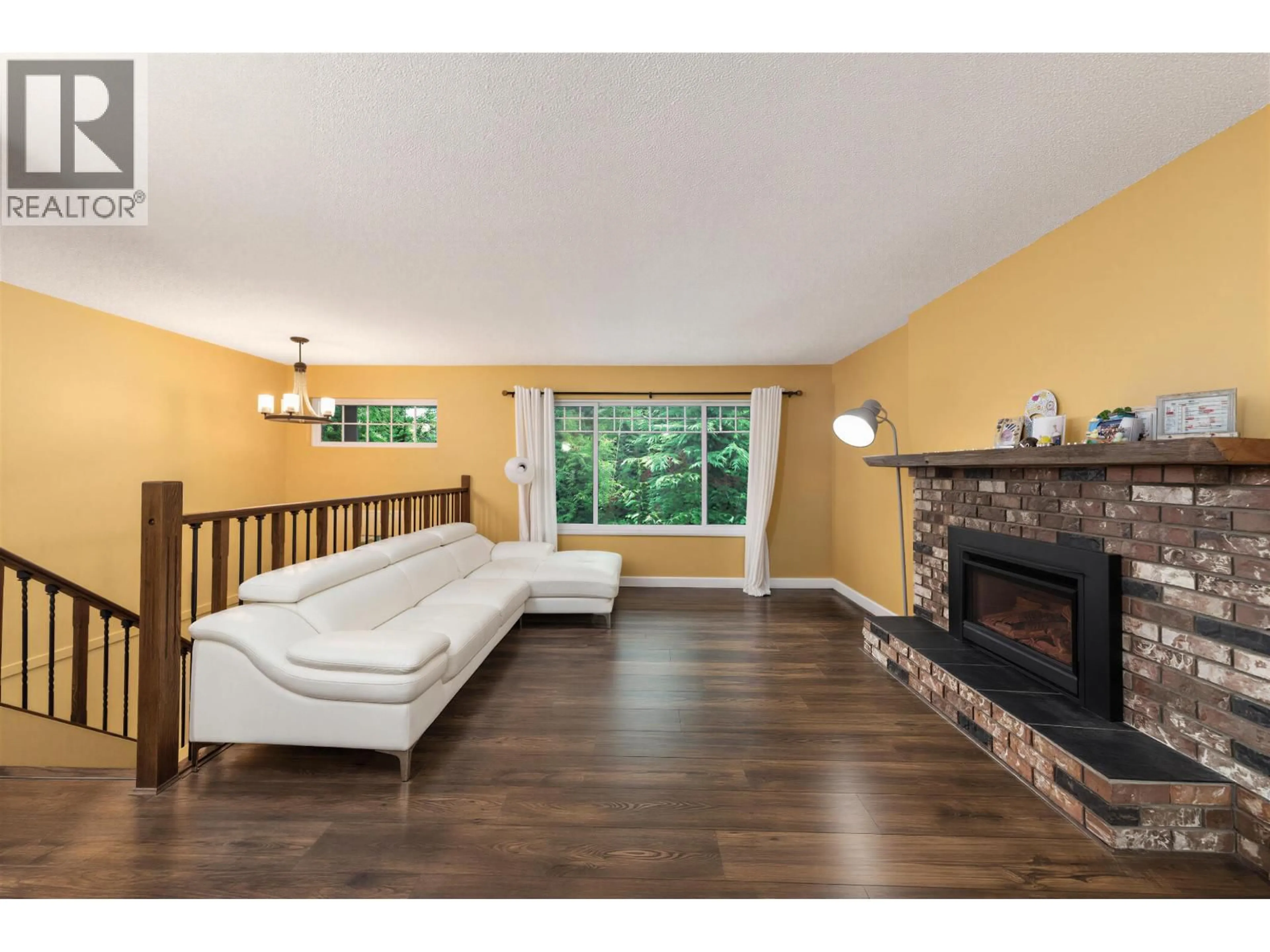 Living room with furniture, wood/laminate floor for 1650 CONNAUGHT DRIVE, Port Coquitlam British Columbia V3C4G8