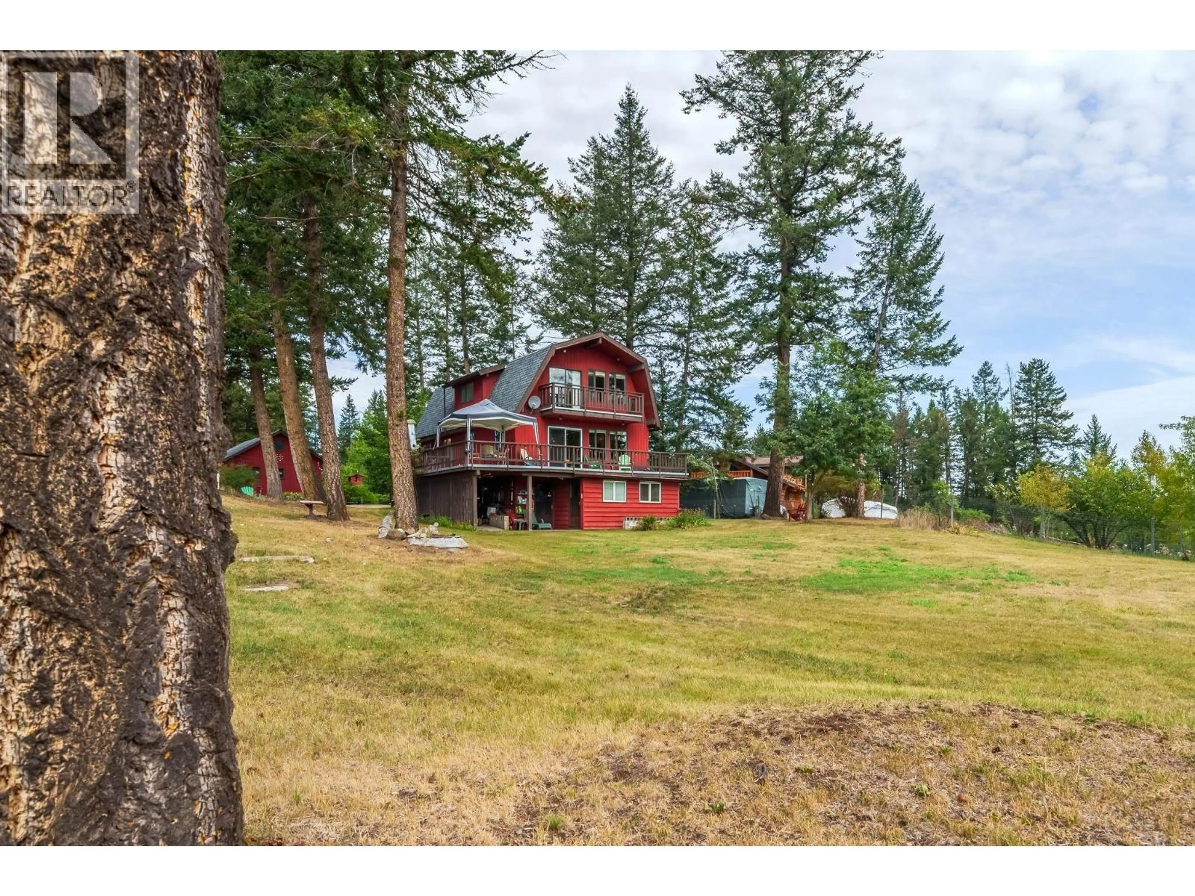 A pic from outside/outdoor area/front of a property/back of a property/a pic from drone, unknown for 5355 ANNAHAM CRESCENT, 108 Mile Ranch British Columbia V0K2Z0