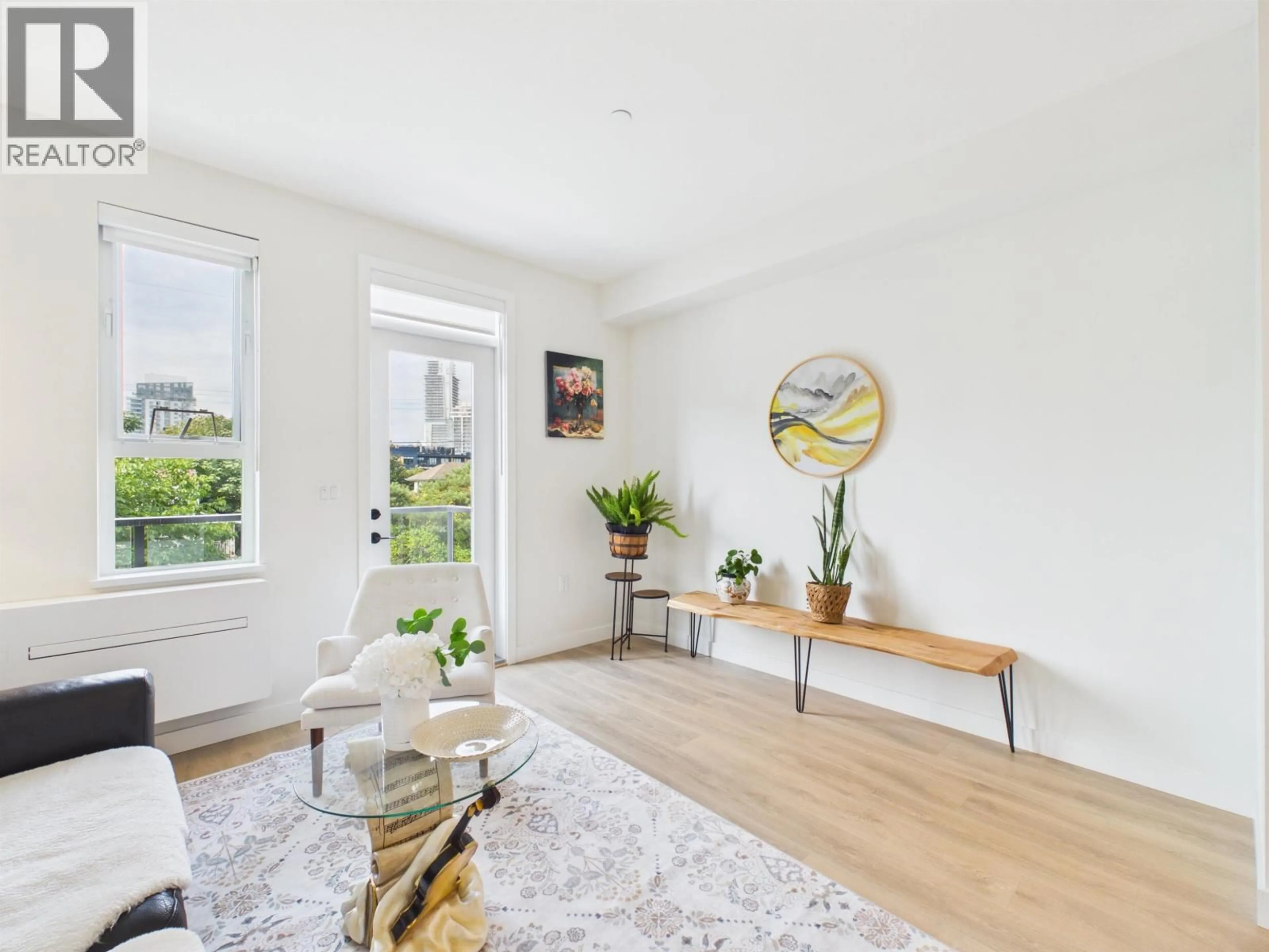 Living room with furniture, wood/laminate floor for 210 - 715 DUCKLOW STREET, Coquitlam British Columbia V3J4C9