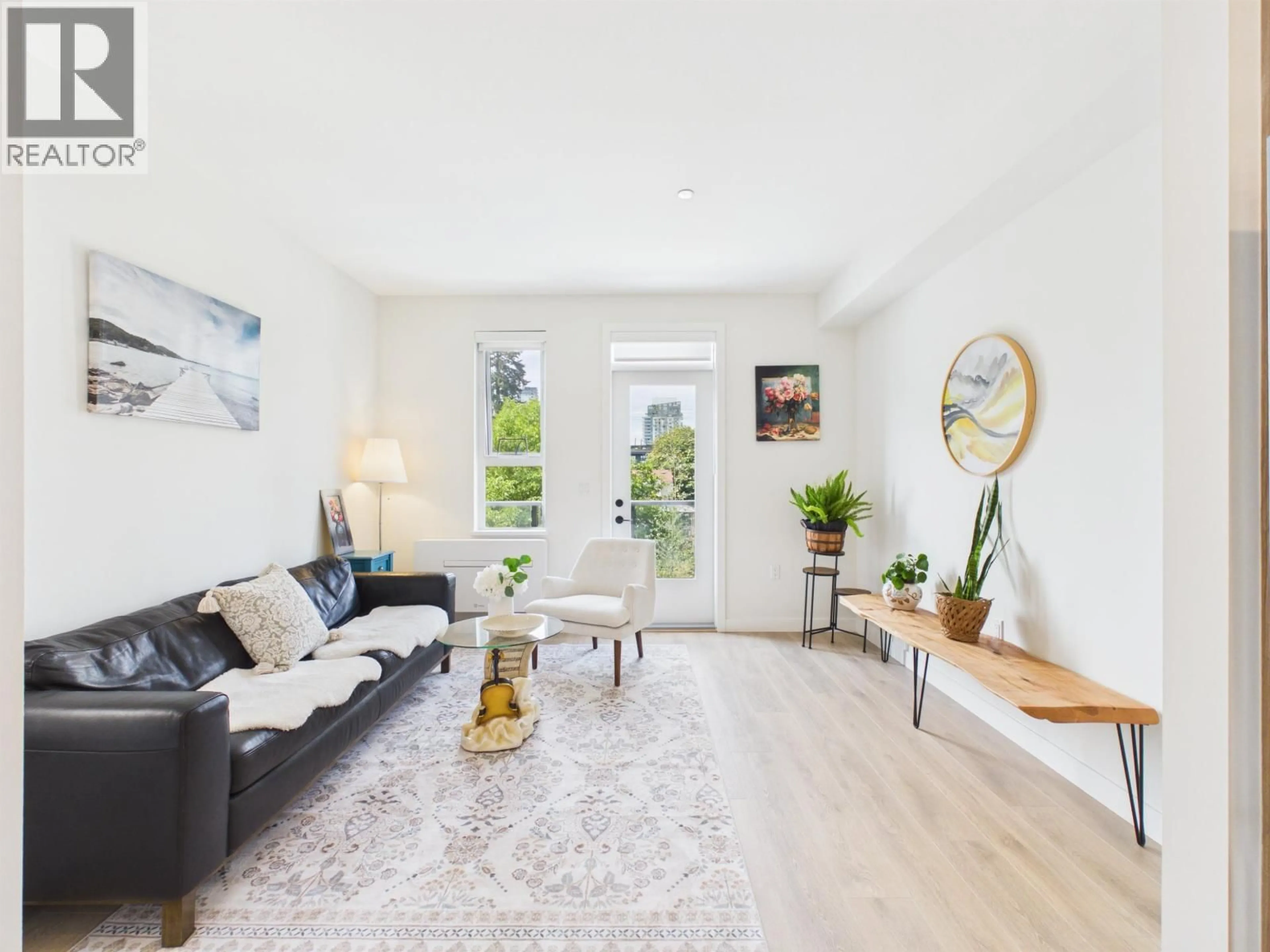 Living room with furniture, wood/laminate floor for 210 - 715 DUCKLOW STREET, Coquitlam British Columbia V3J4C9