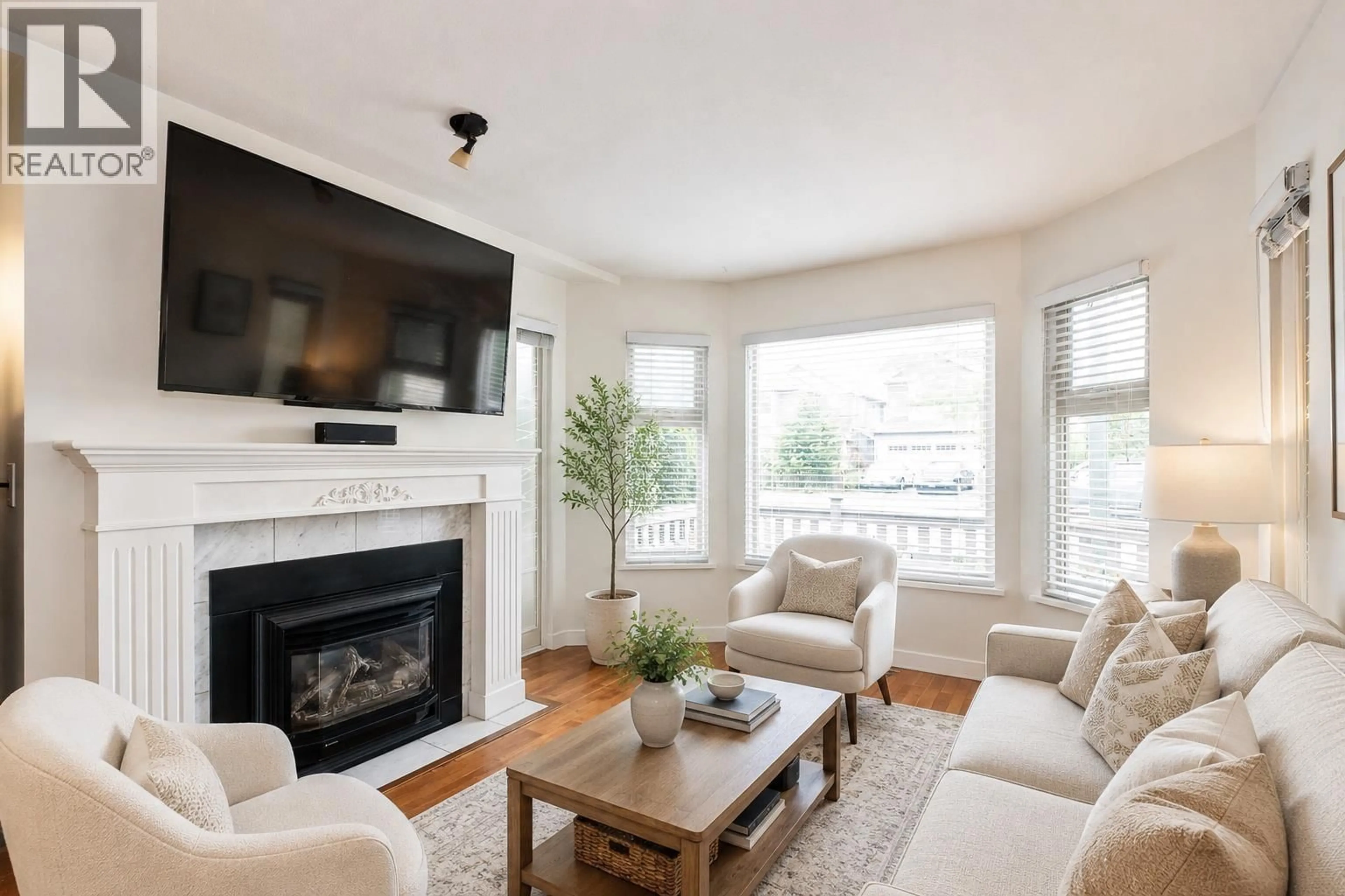 Living room with furniture, wood/laminate floor for C101 - 4831 53 STREET, Delta British Columbia V4K2Z3
