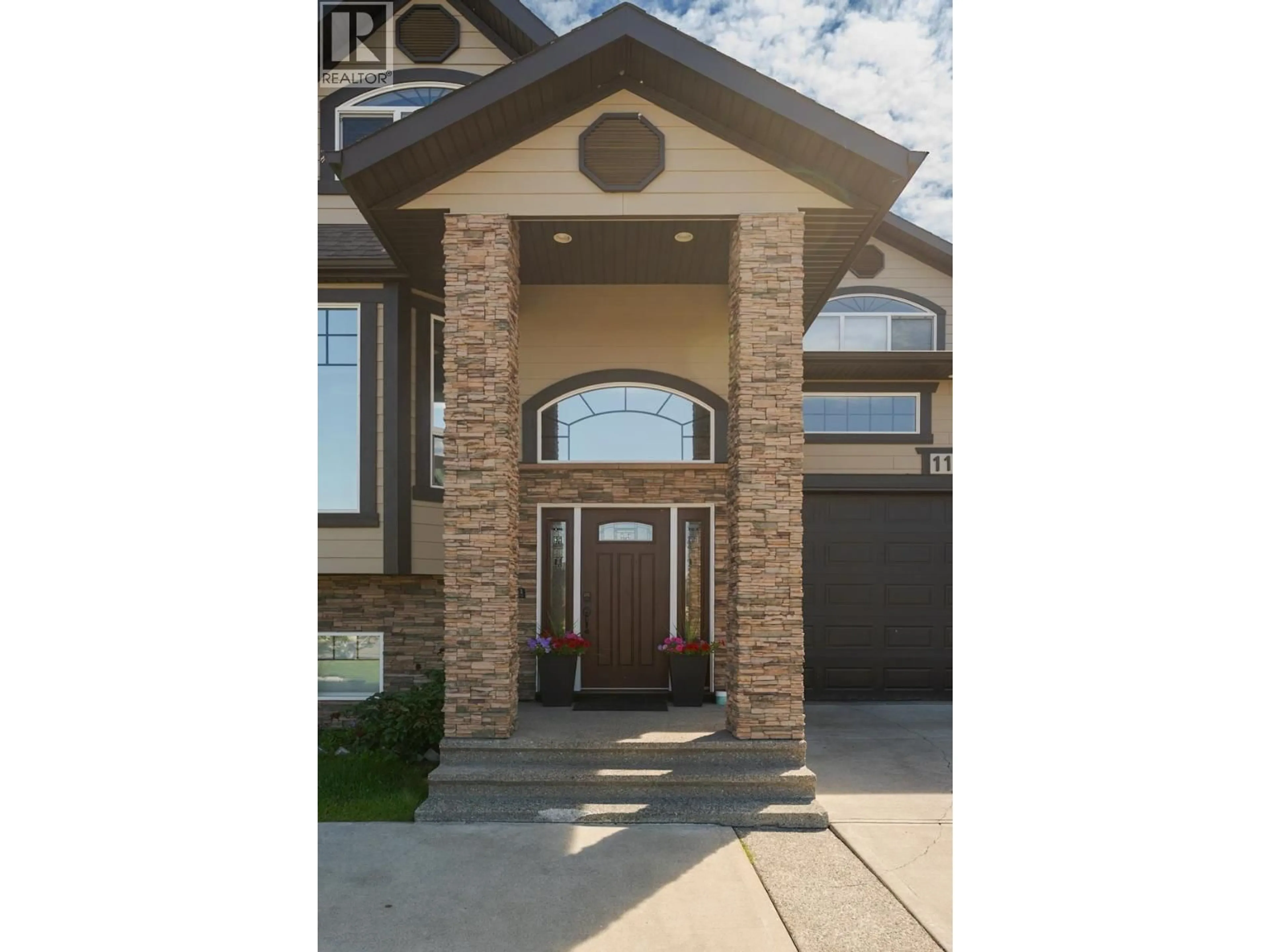 Home with brick exterior material, street for 1115 ABRUZZI PLACE, Prince George British Columbia V2N0B7