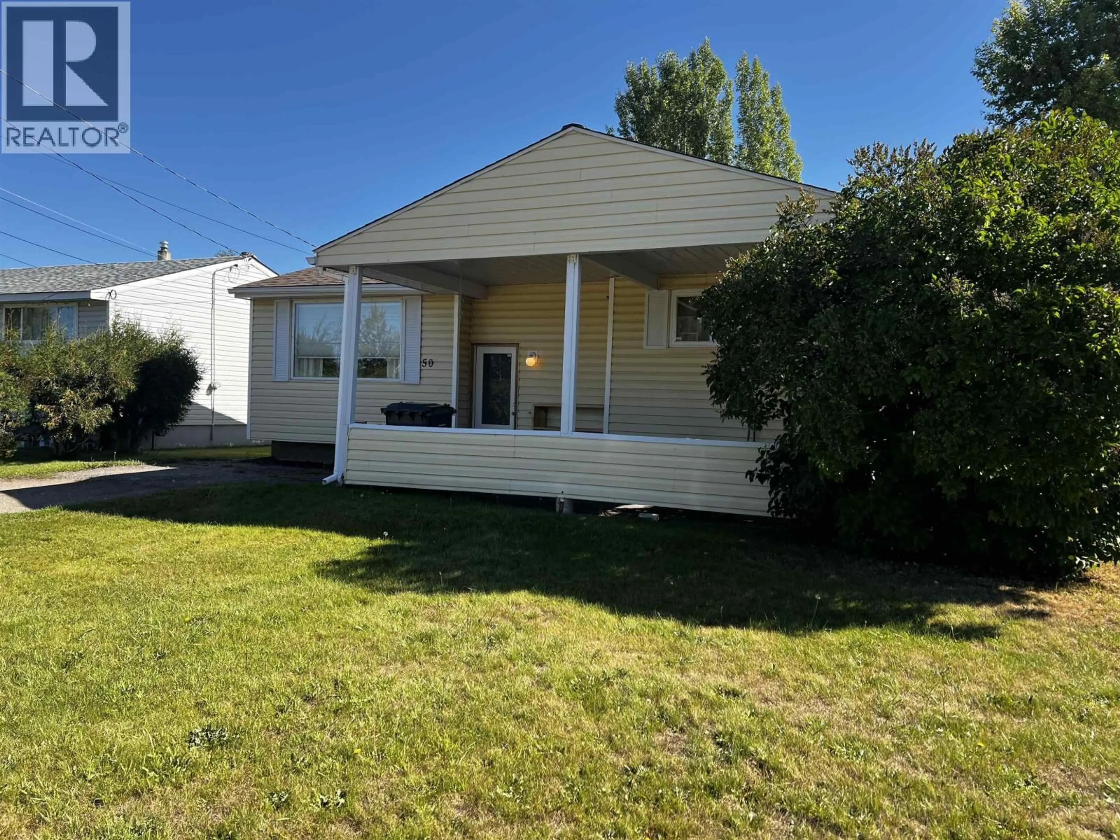 Home with vinyl exterior material, street for 50 CHOWSUNKET STREET, Fraser Lake British Columbia V0J1S0