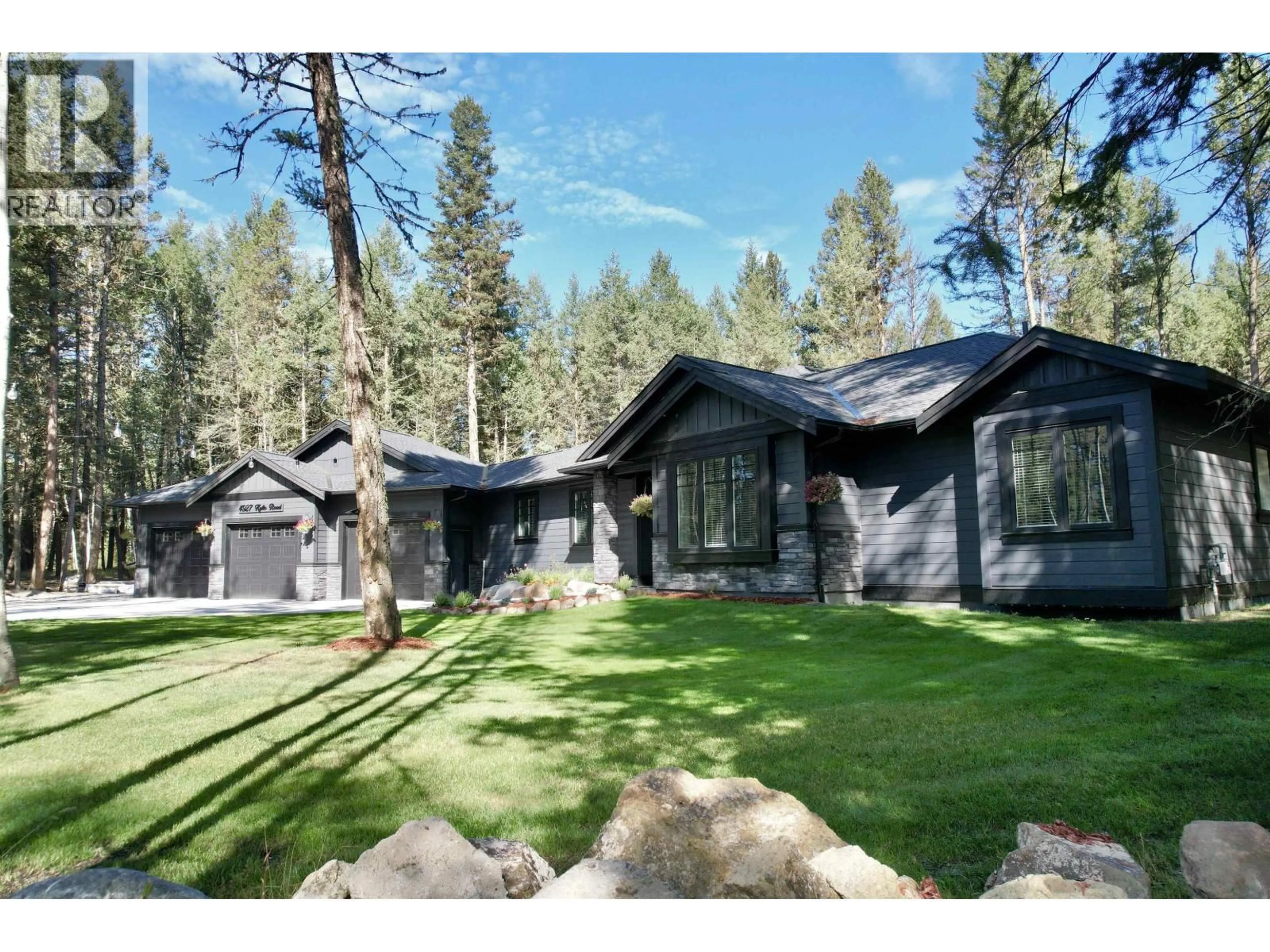 Home with vinyl exterior material, forest/trees view for 4927 KYLLO ROAD, 108 Mile Ranch British Columbia V0K2Z0