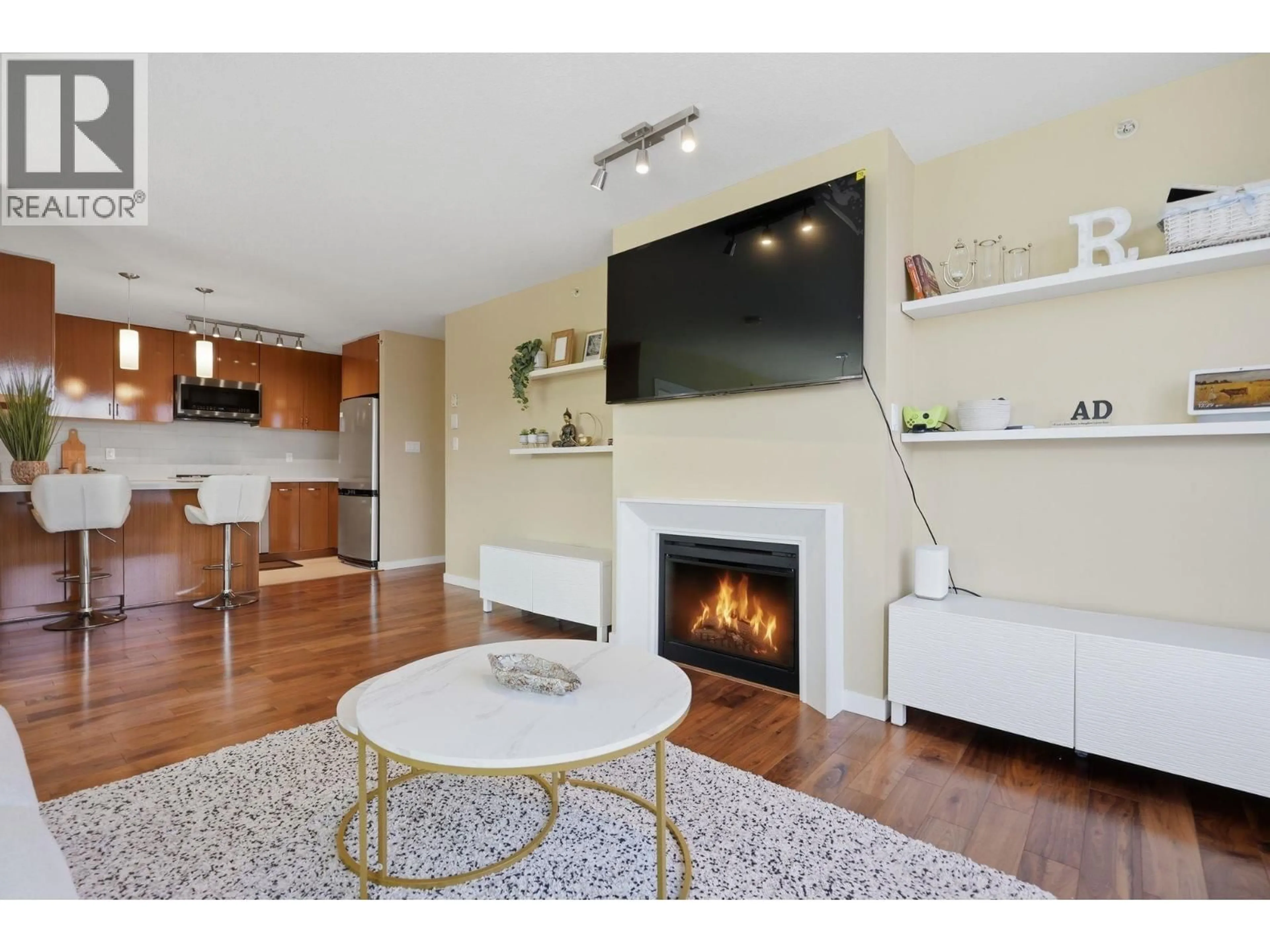 Living room with furniture, wood/laminate floor for 1505 - 1185 THE HIGH STREET, Coquitlam British Columbia V3B0A9