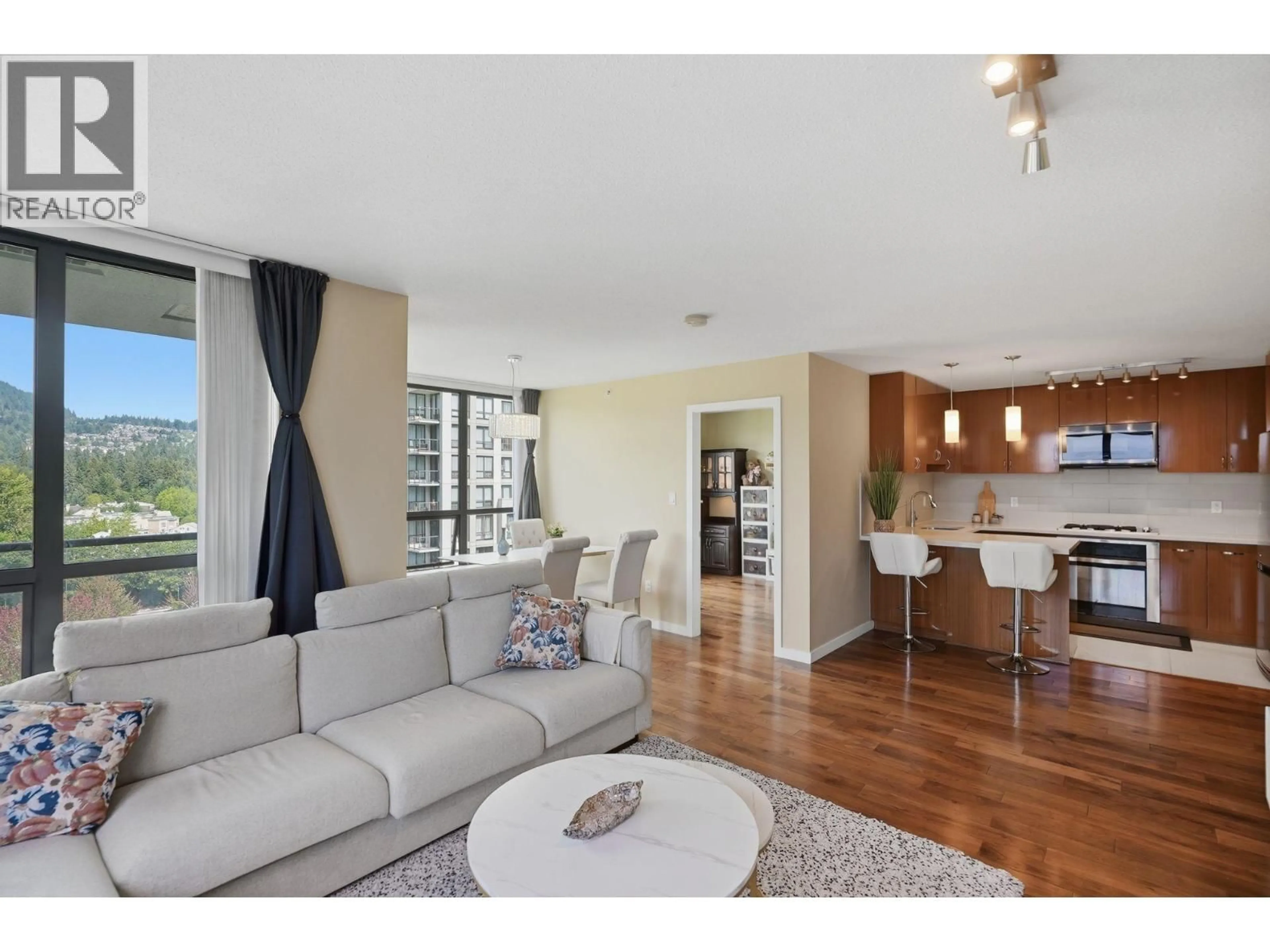Living room with furniture, wood/laminate floor for 1505 - 1185 THE HIGH STREET, Coquitlam British Columbia V3B0A9