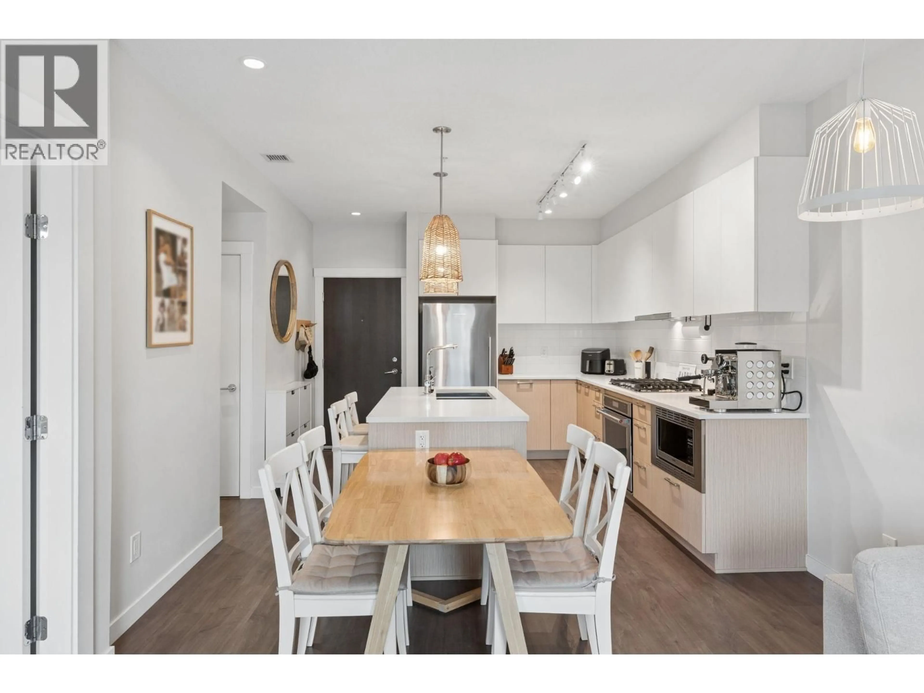 Open concept kitchen, wood/laminate floor for 210 - 625 3RD STREET, North Vancouver British Columbia V7L1G6
