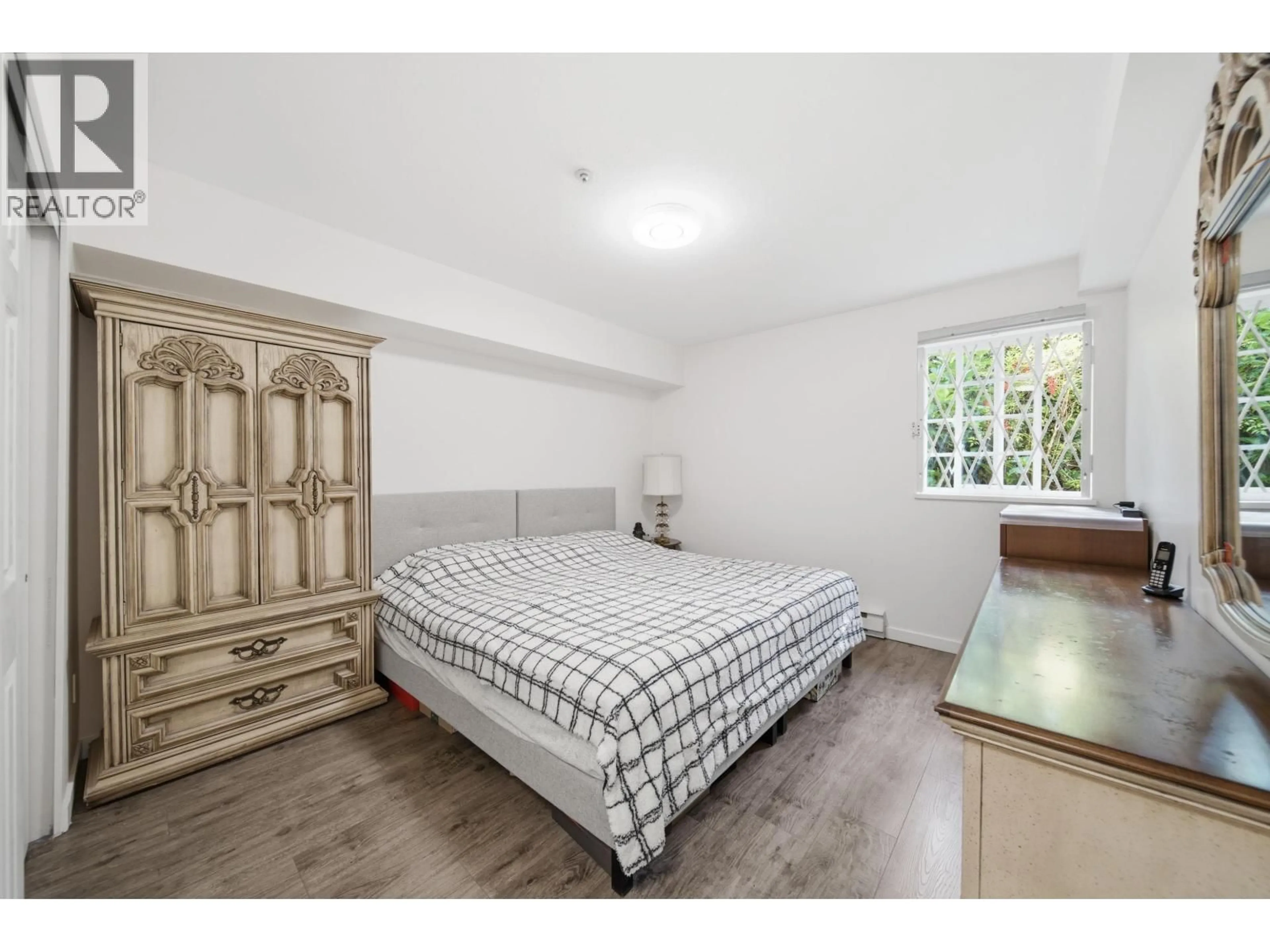 Bedroom with bed, wood/laminate floor for 107 - 5788 VINE STREET, Vancouver British Columbia V6M4L8