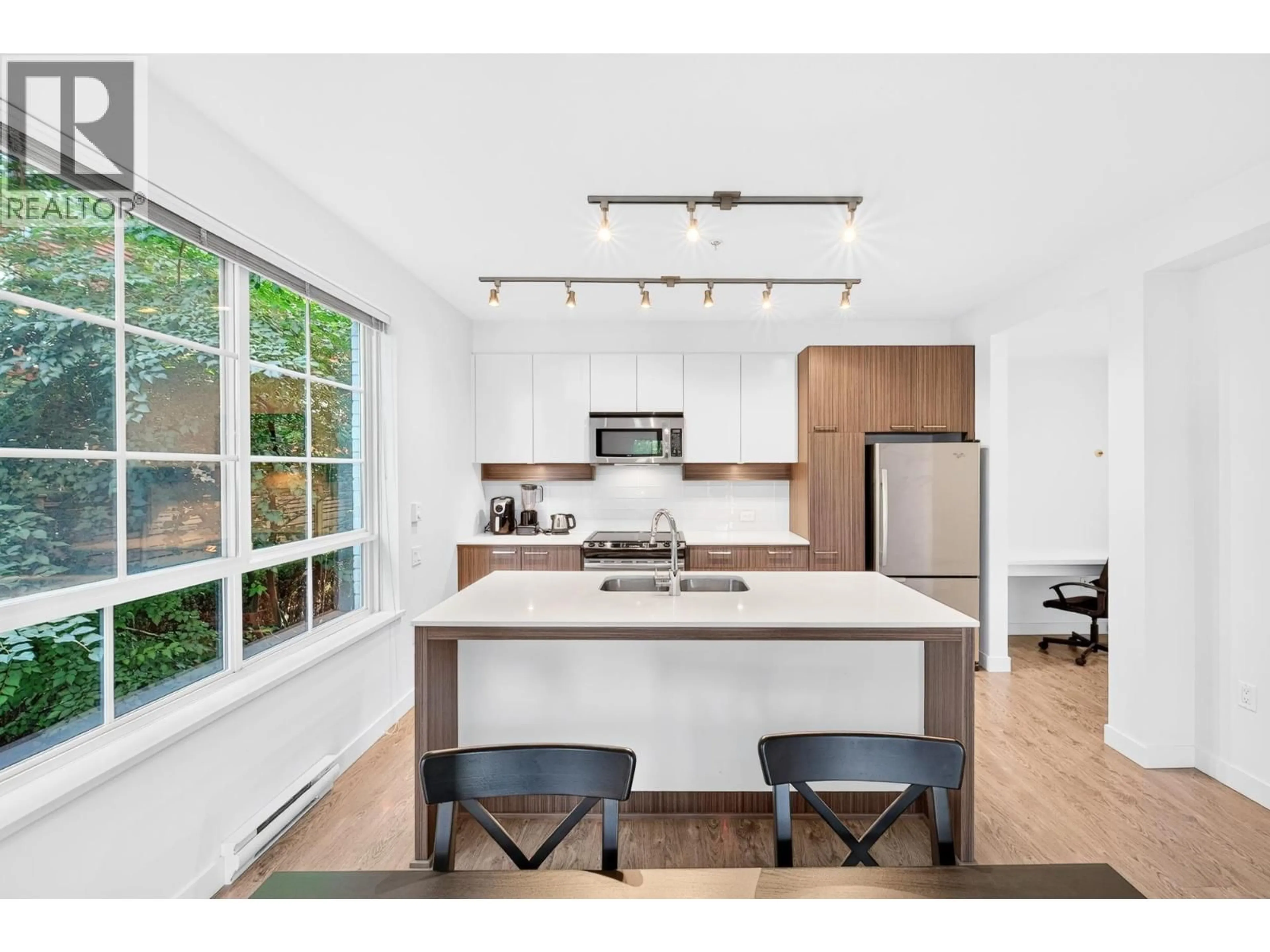 Open concept kitchen, wood/laminate floor for 203 - 608 COMO LAKE AVENUE, Coquitlam British Columbia V3J0B2