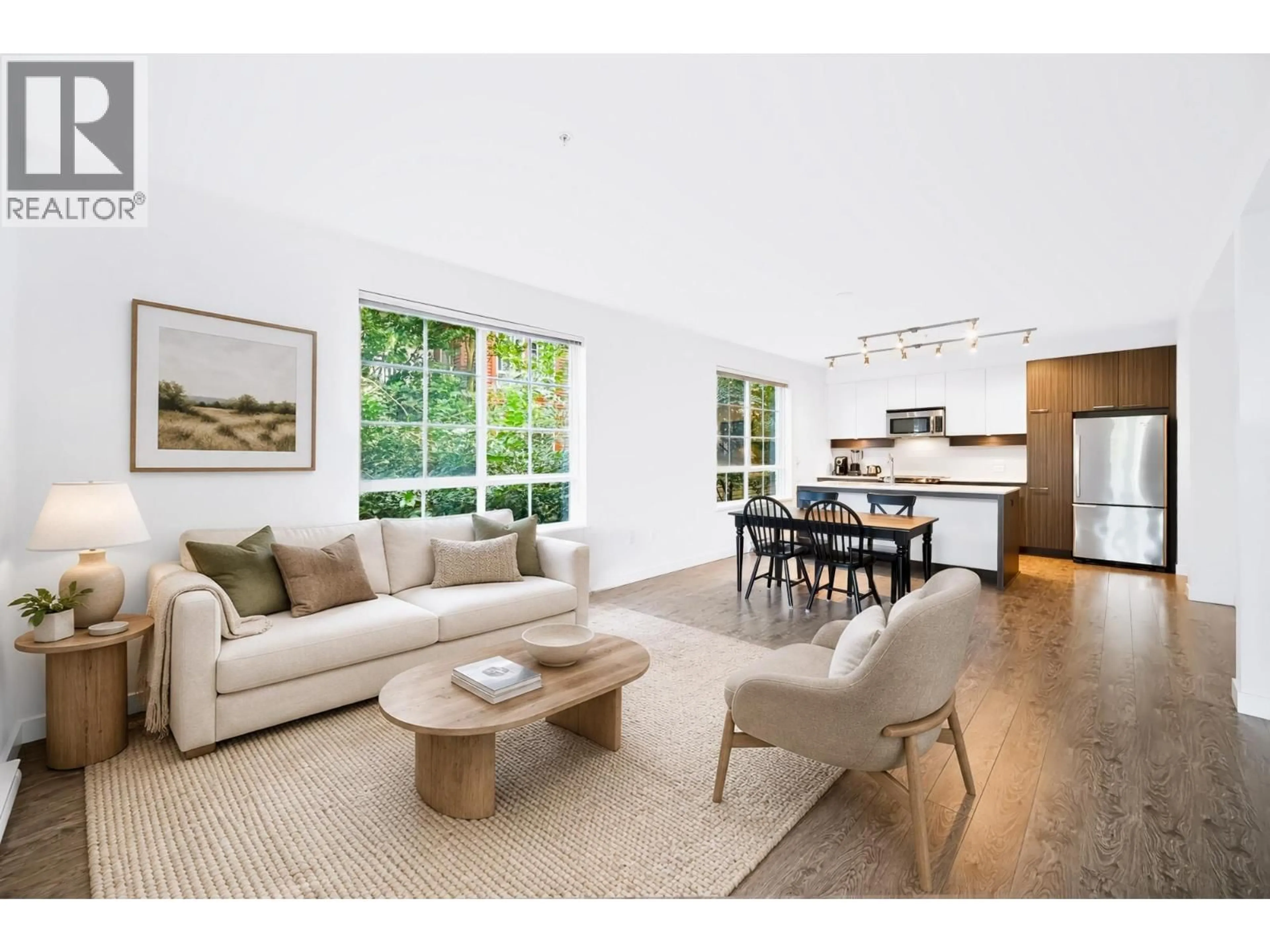 Living room with furniture, unknown for 203 - 608 COMO LAKE AVENUE, Coquitlam British Columbia V3J0B2