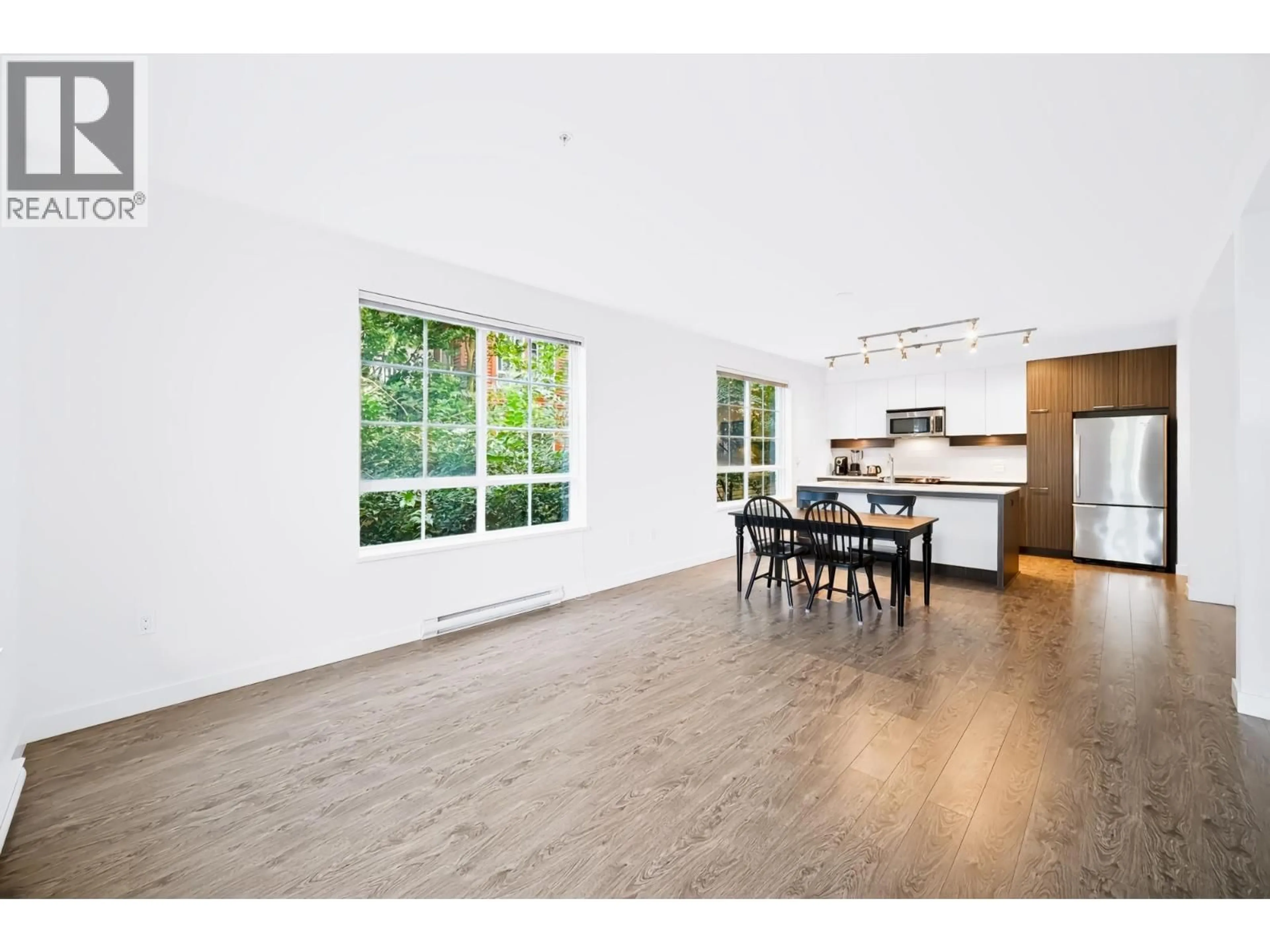 Open concept kitchen, wood/laminate floor for 203 - 608 COMO LAKE AVENUE, Coquitlam British Columbia V3J0B2