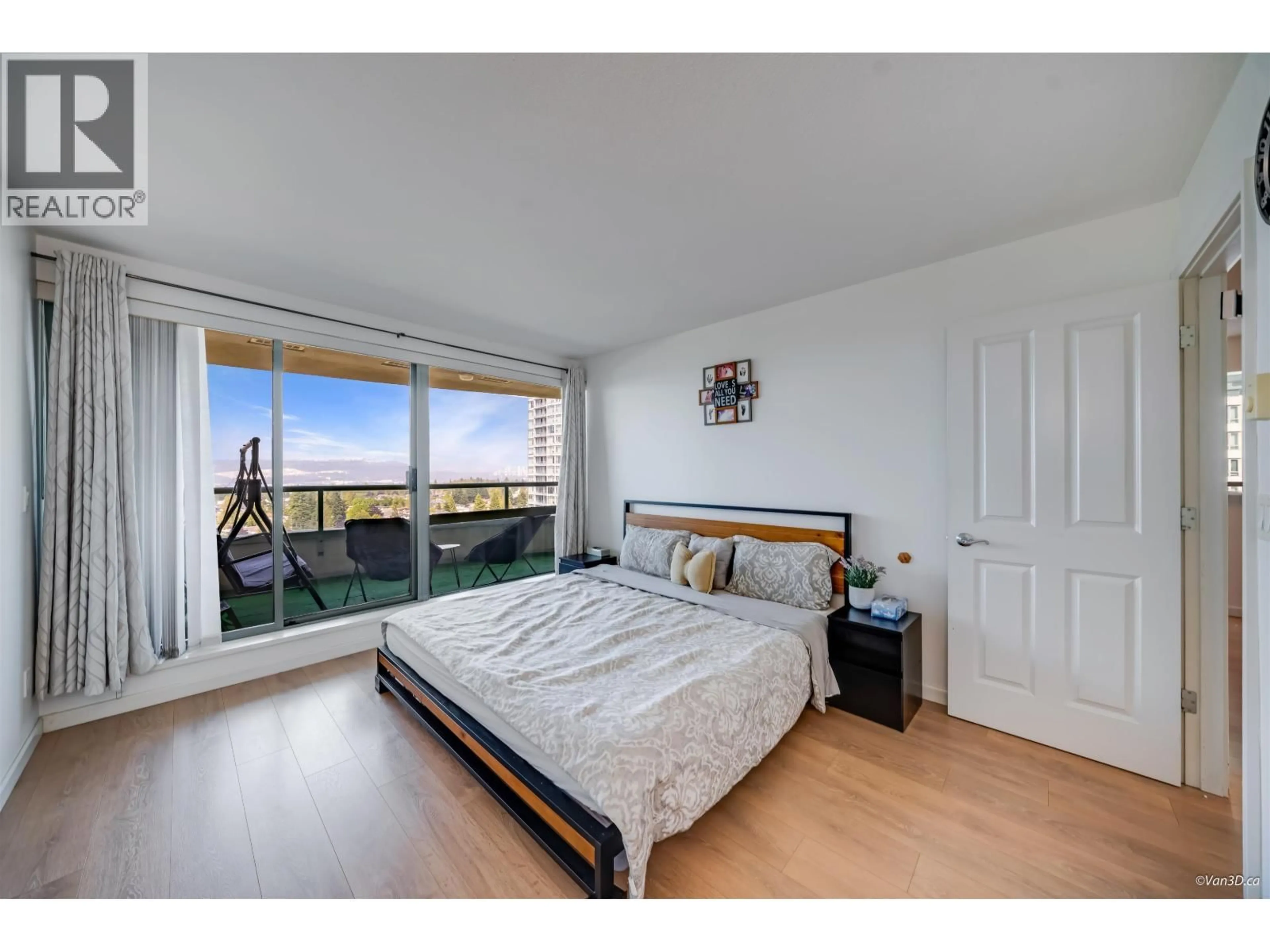 Bedroom with bed, wood/laminate floor for 1801 - 6611 SOUTHOAKS CRESCENT, Burnaby British Columbia V5E4L5