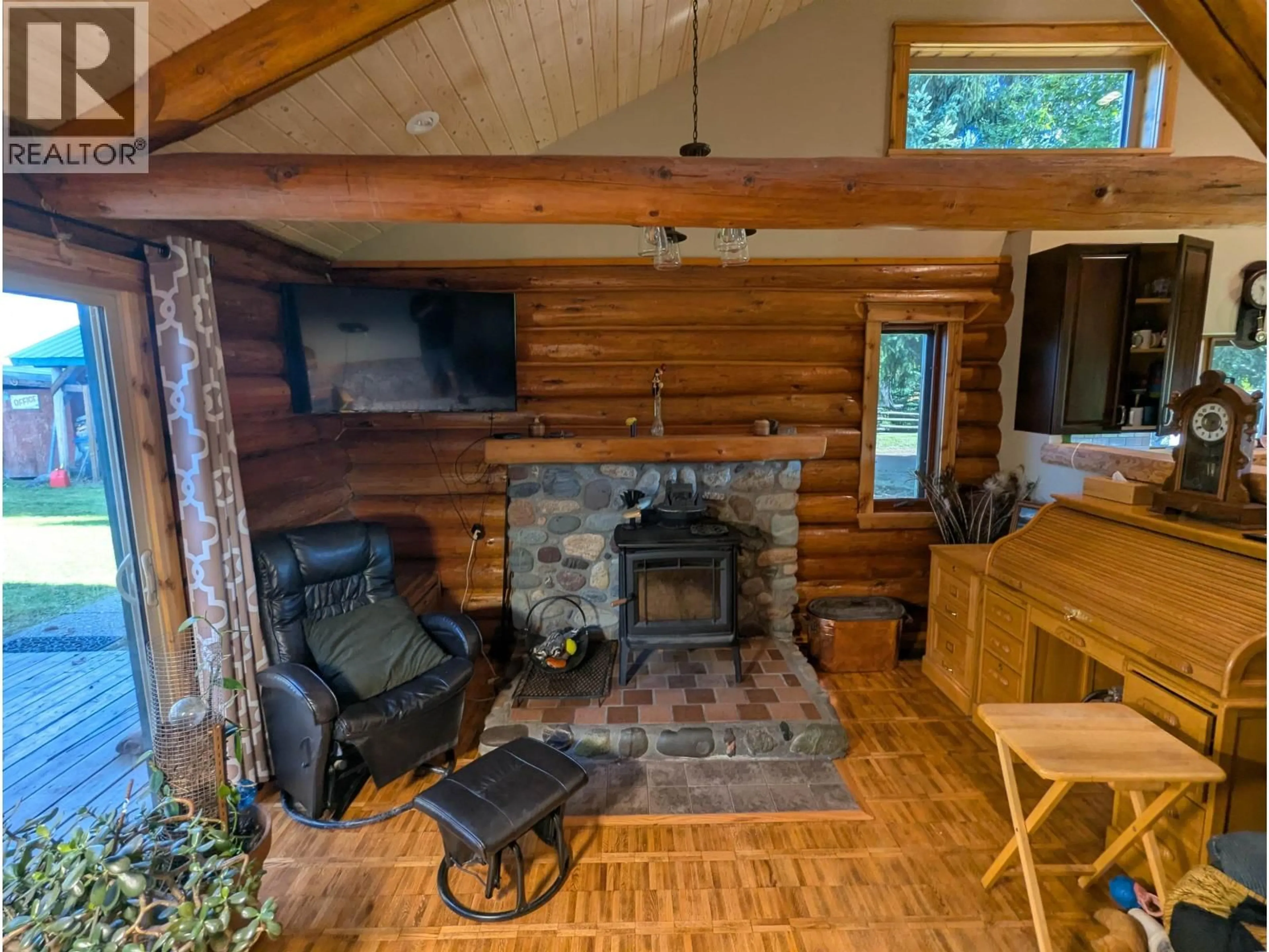 Living room with furniture, wood/laminate floor for 1176 COALMINE ROAD, Telkwa British Columbia V0J2X0
