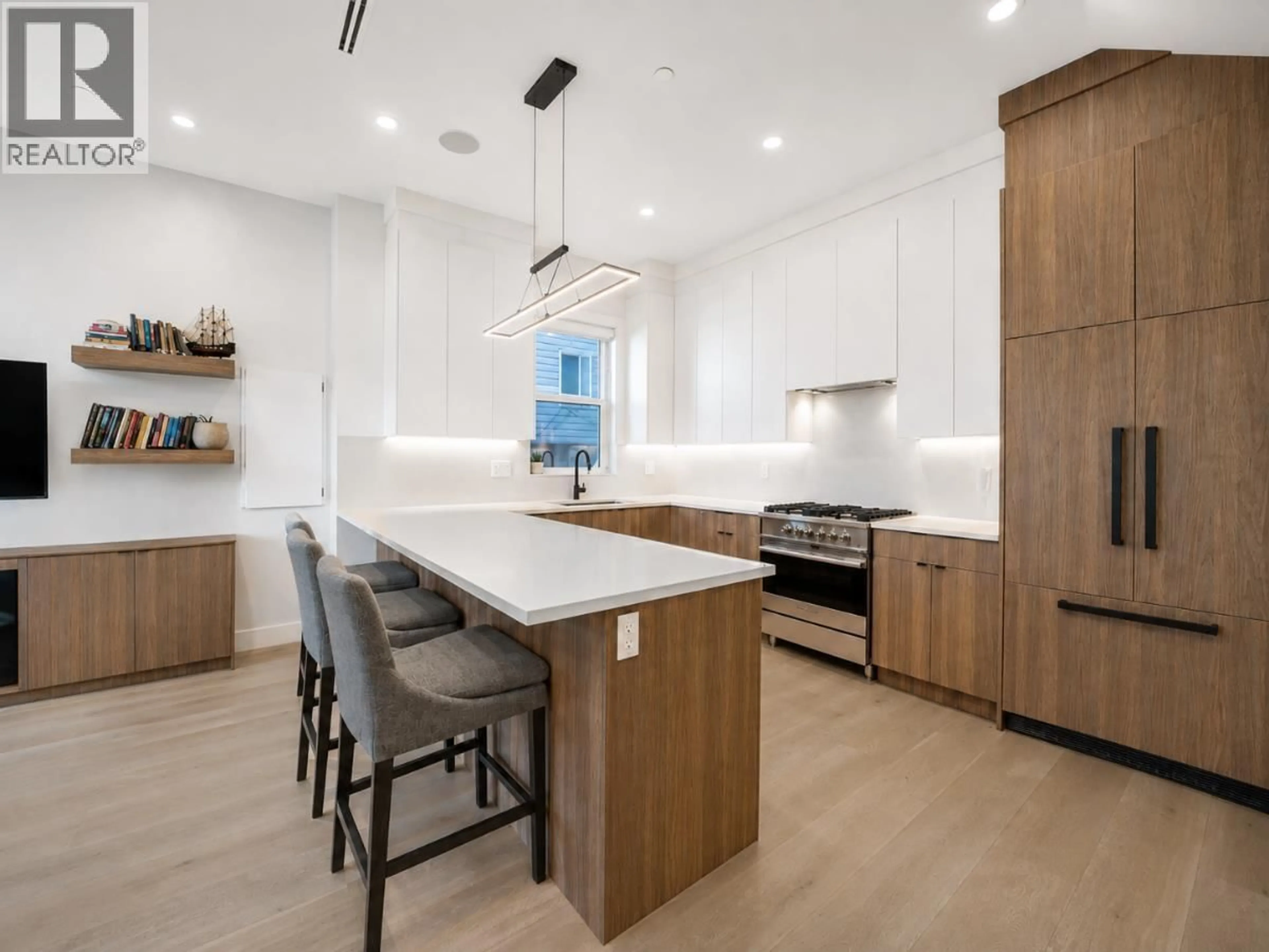 Open concept kitchen, wood/laminate floor for 1907 40TH AVENUE, Vancouver British Columbia V5P1J1