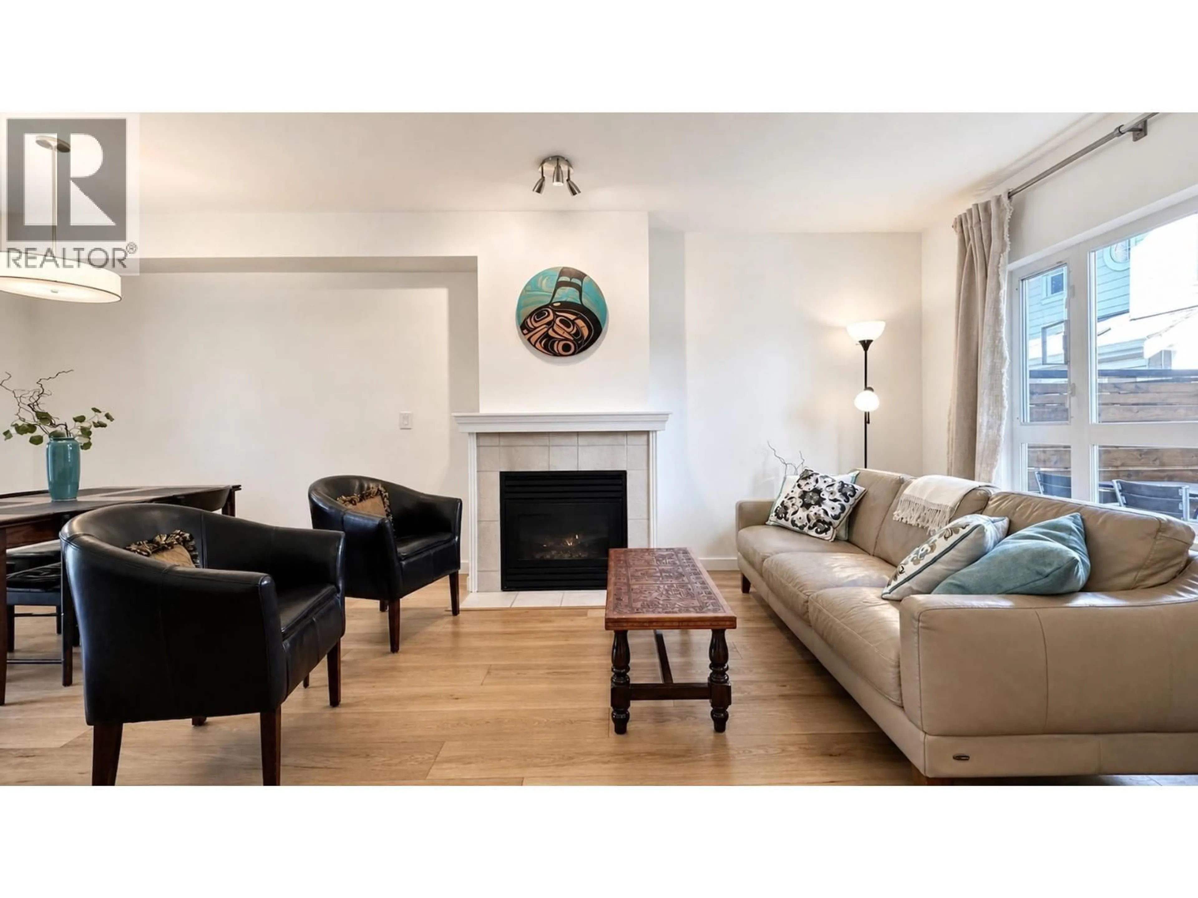 Living room with furniture, wood/laminate floor for 13 - 915 TOBRUCK AVENUE, North Vancouver British Columbia V7P1V9