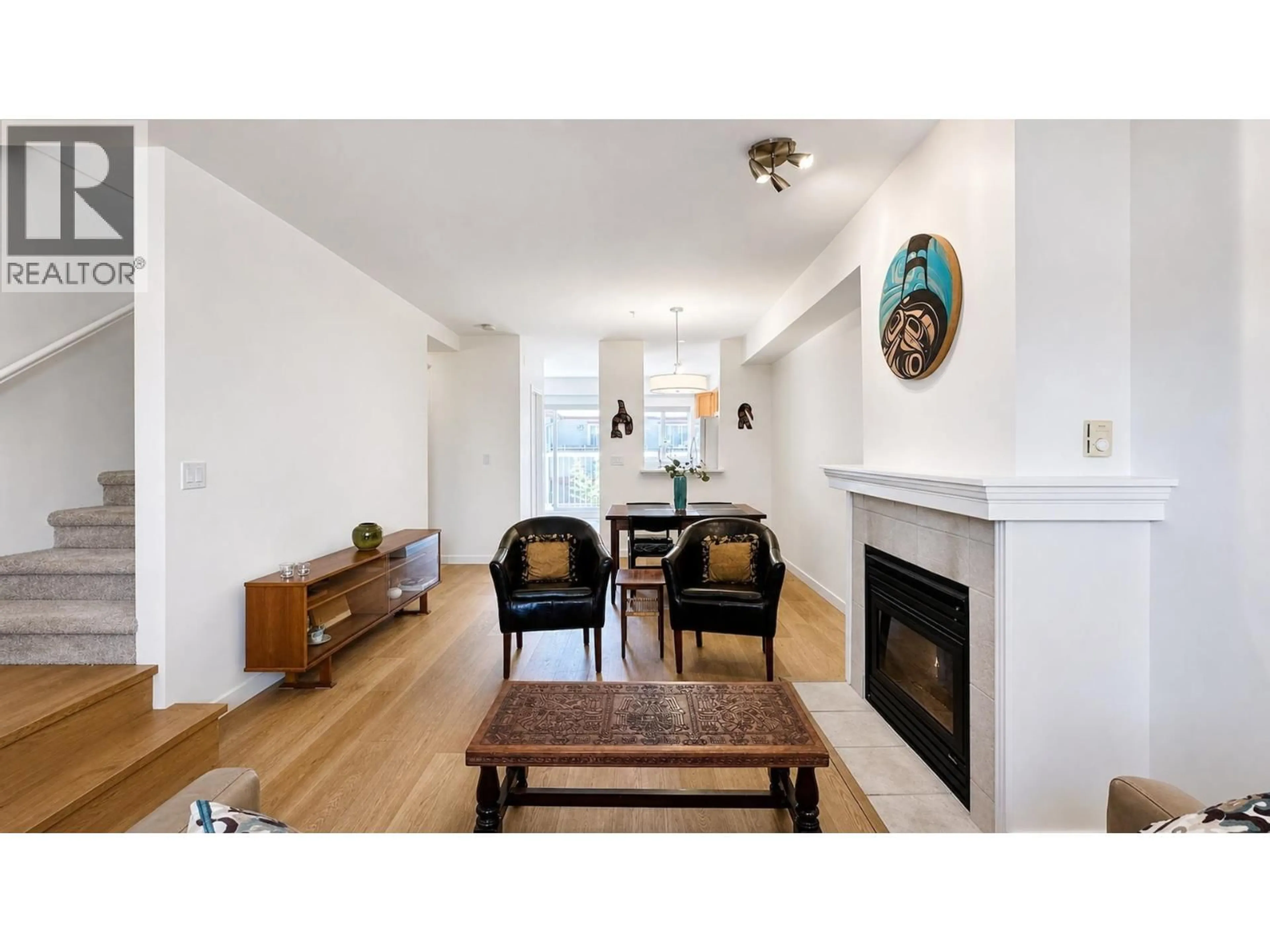 Living room with furniture, wood/laminate floor for 13 - 915 TOBRUCK AVENUE, North Vancouver British Columbia V7P1V9
