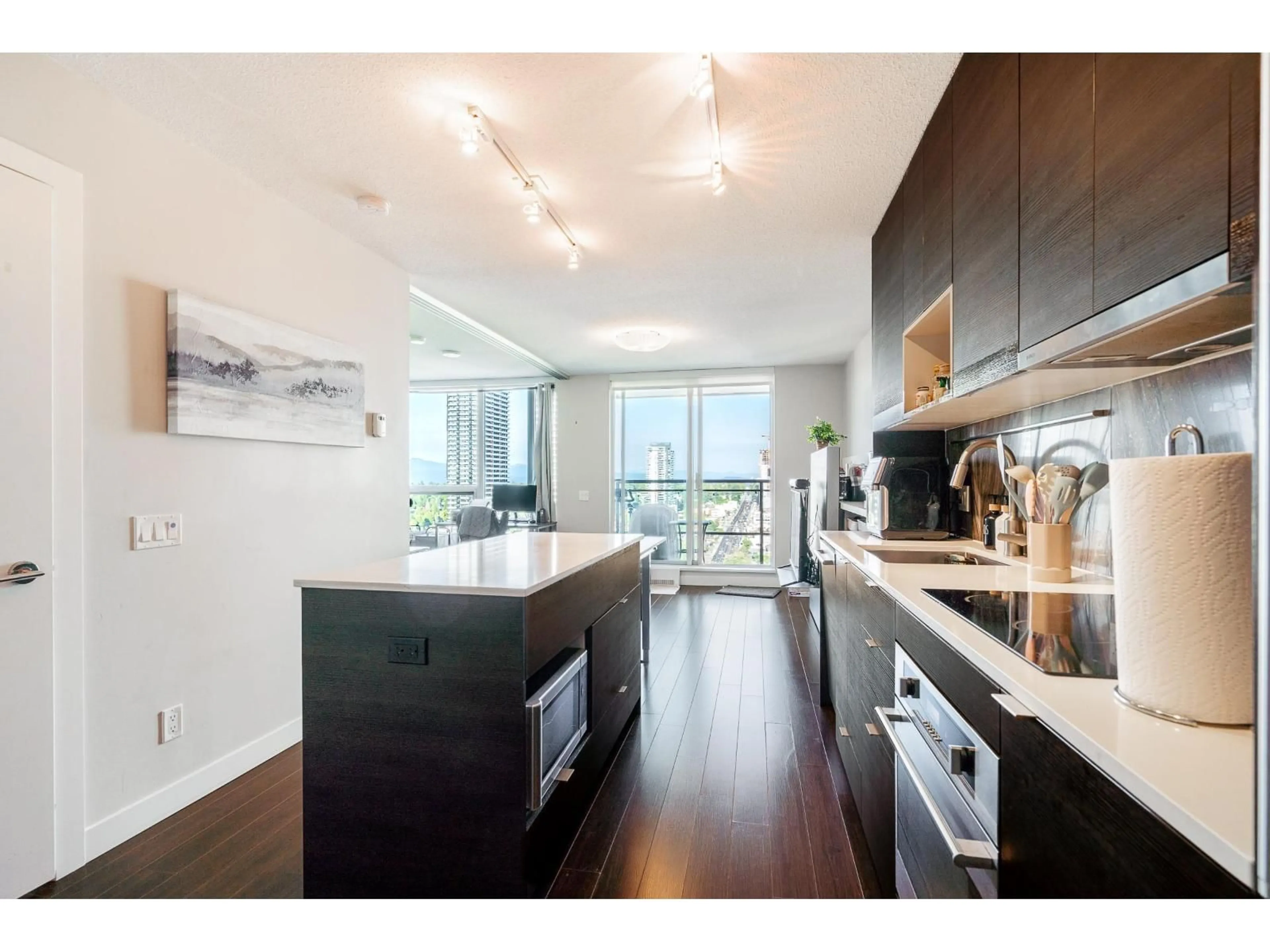 Open concept kitchen, wood/laminate floor for 2608 - 13398 104 AVENUE, Surrey British Columbia V3T1V6