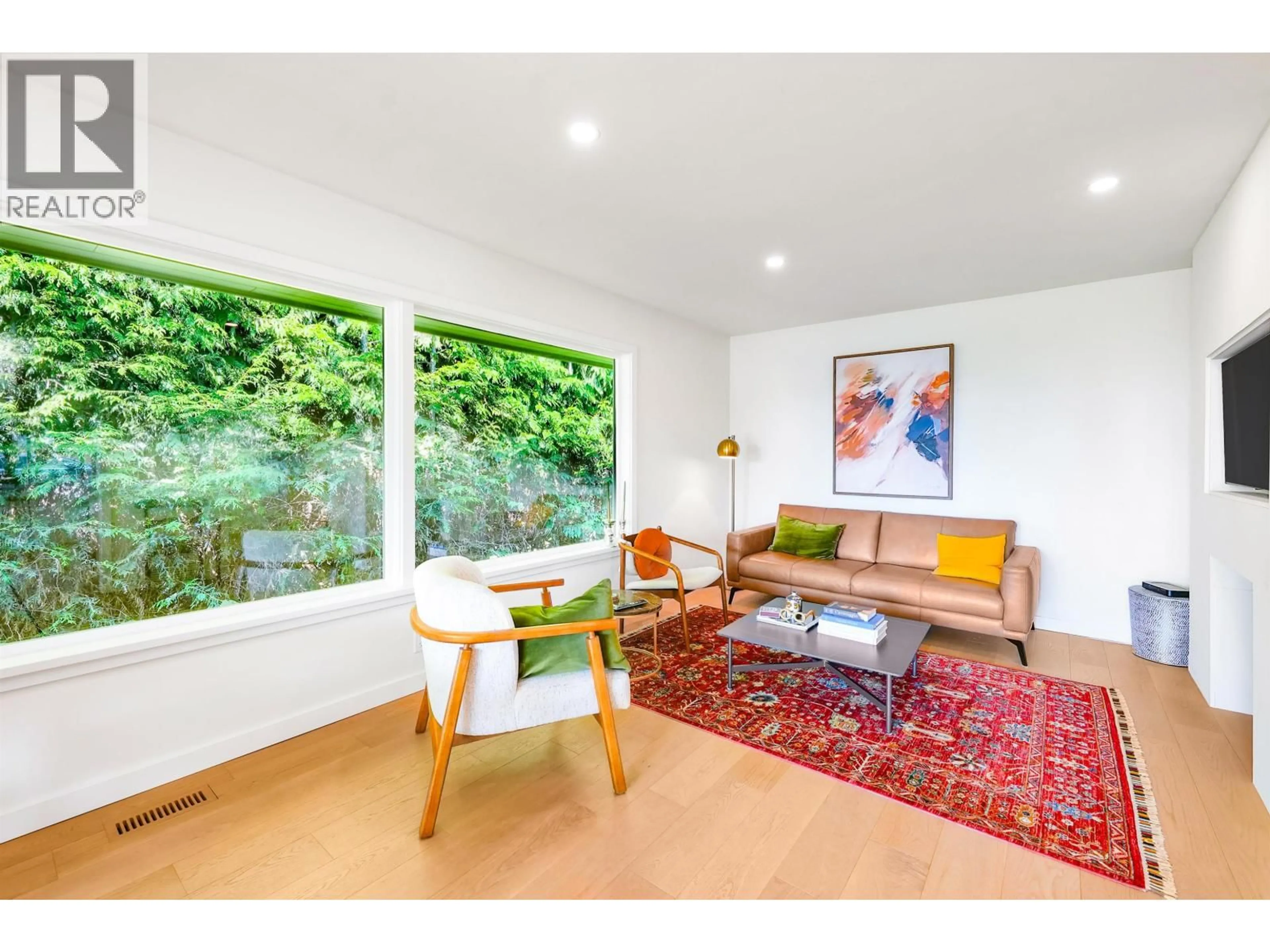 Living room with furniture, wood/laminate floor for 3277 CHESTERFIELD AVENUE, North Vancouver British Columbia V7N3M8