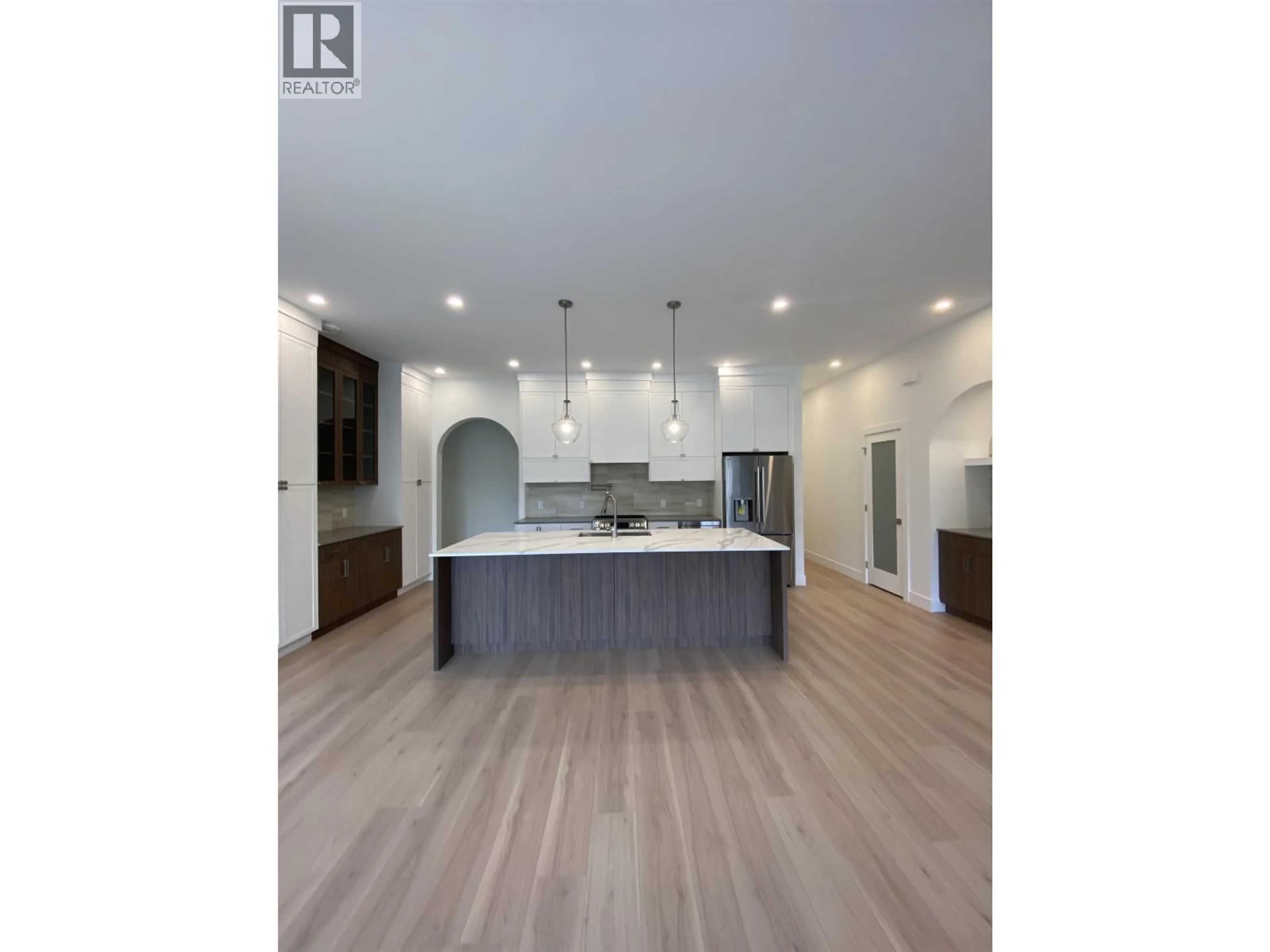Open concept kitchen, wood/laminate floor for 4004 NASH DRIVE, Terrace British Columbia V8G0L3