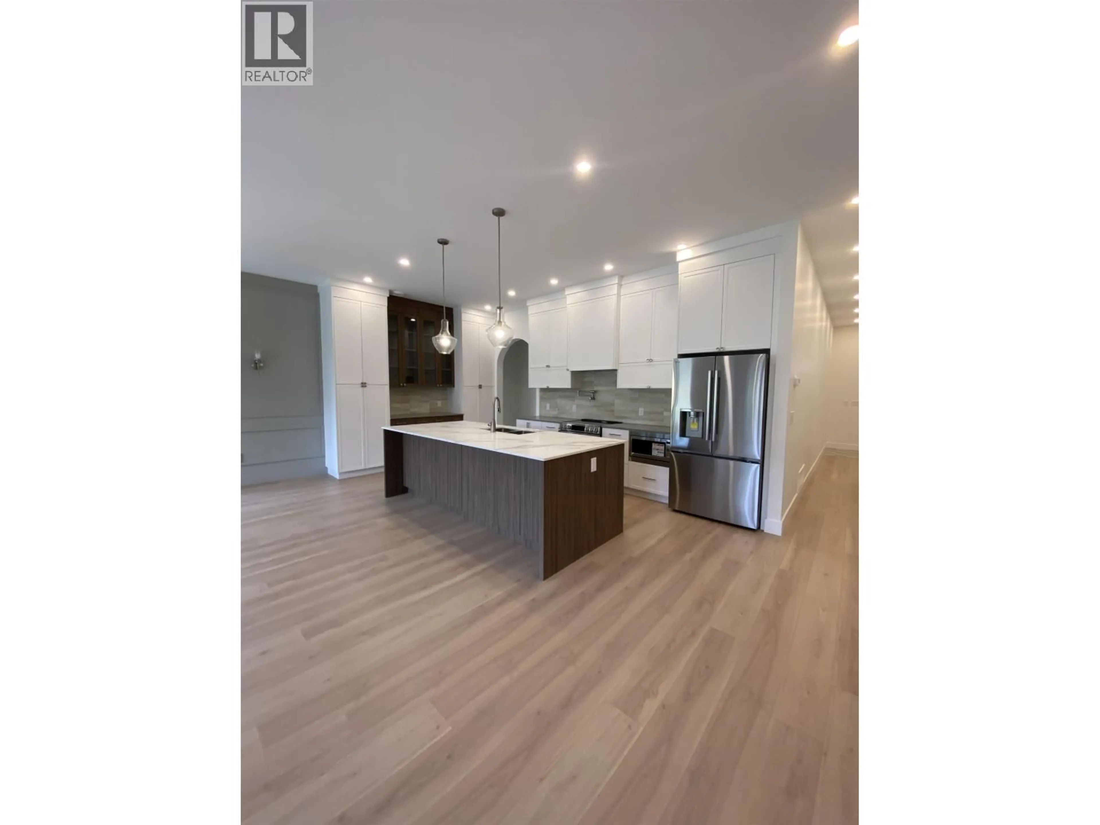 Open concept kitchen, wood/laminate floor for 4004 NASH DRIVE, Terrace British Columbia V8G0L3