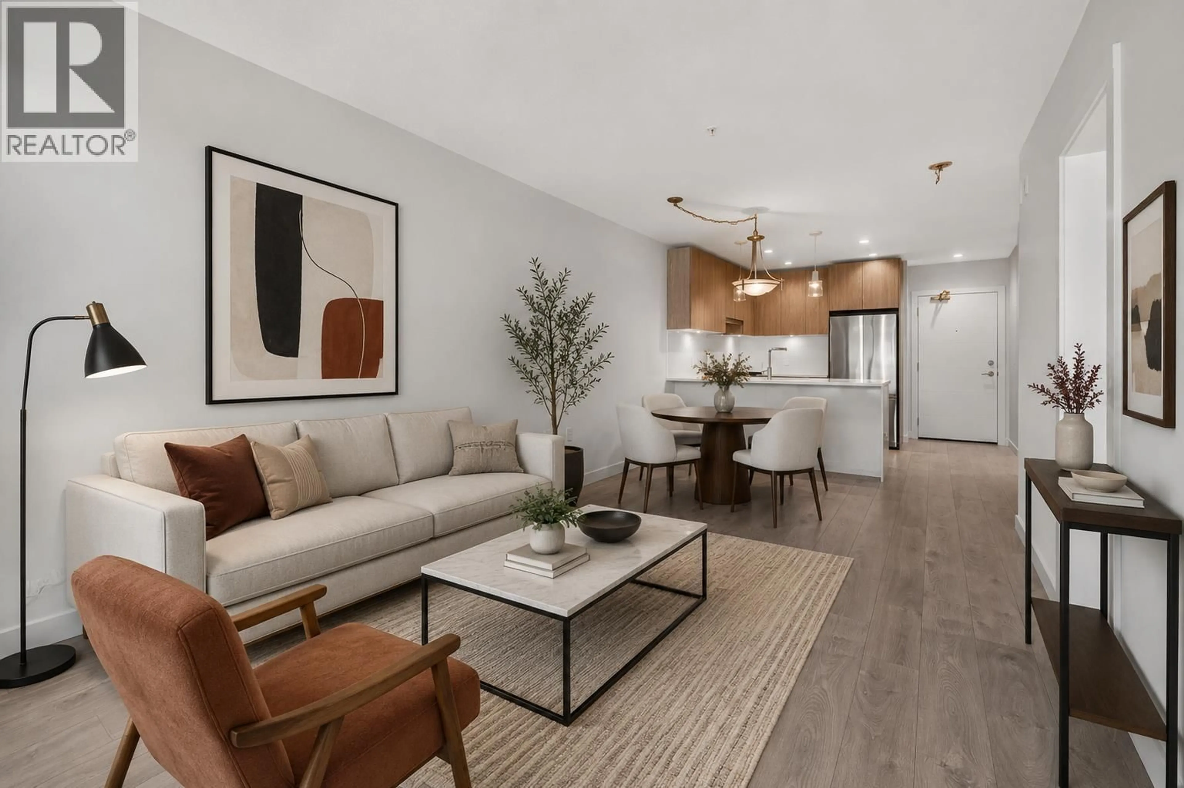 Living room with furniture, wood/laminate floor for 210 - 108 8TH STREET, North Vancouver British Columbia V7L0H1