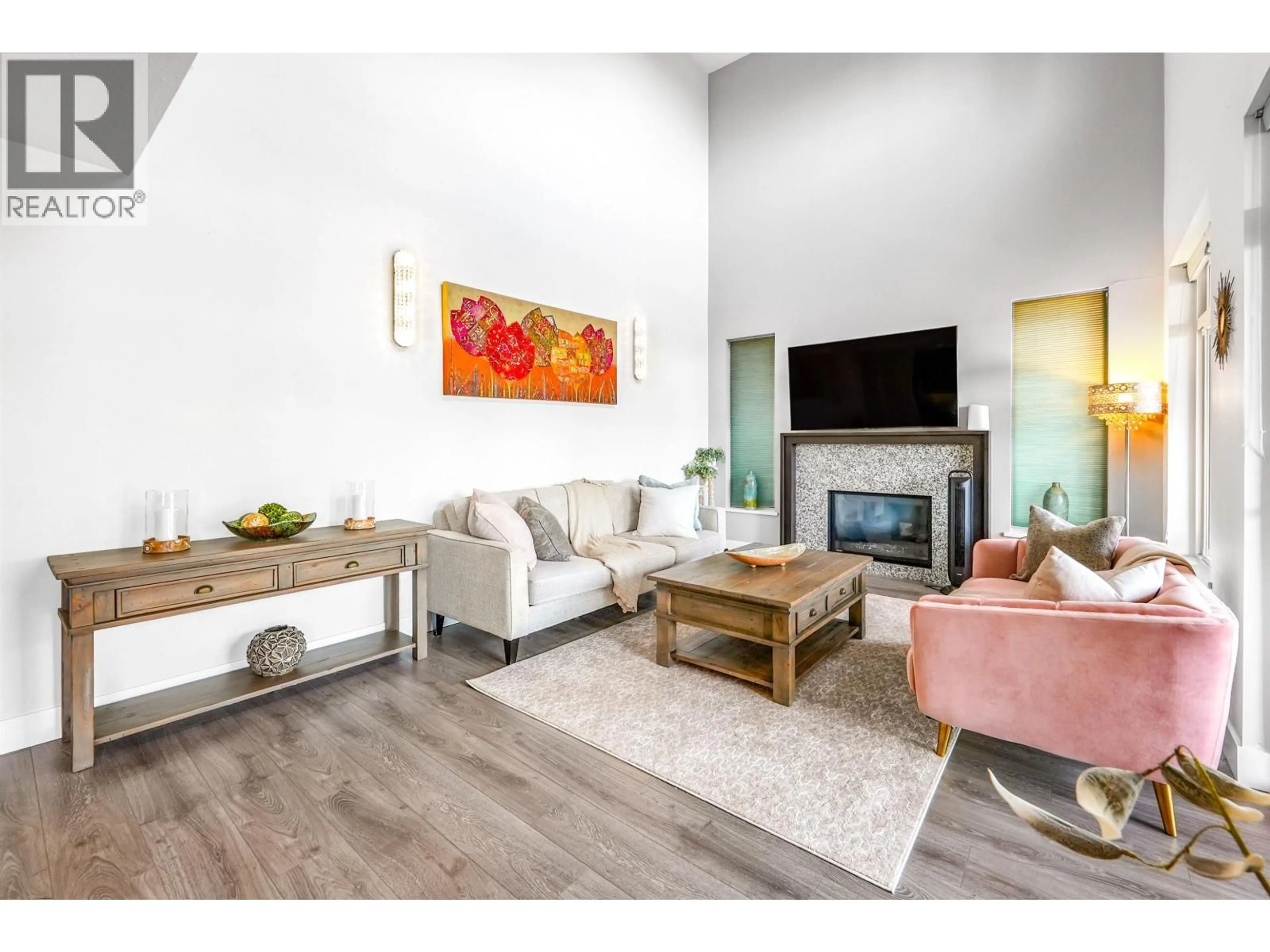 Living room with furniture, wood/laminate floor for 105 - 3450 DAVID AVENUE, Coquitlam British Columbia V3E0B8