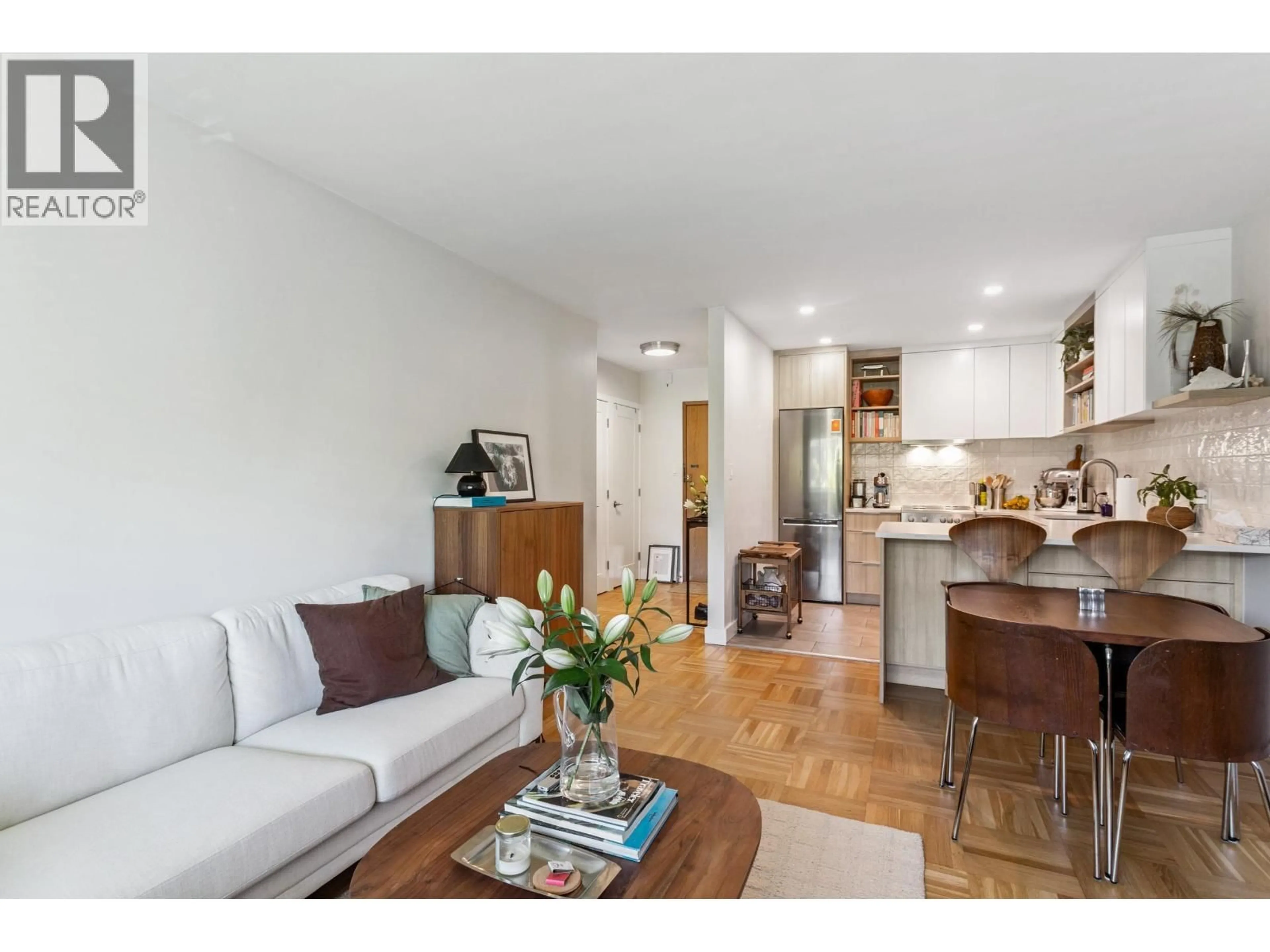 Living room with furniture, wood/laminate floor for 303 - 2469 CORNWALL AVENUE, Vancouver British Columbia V6K1B9