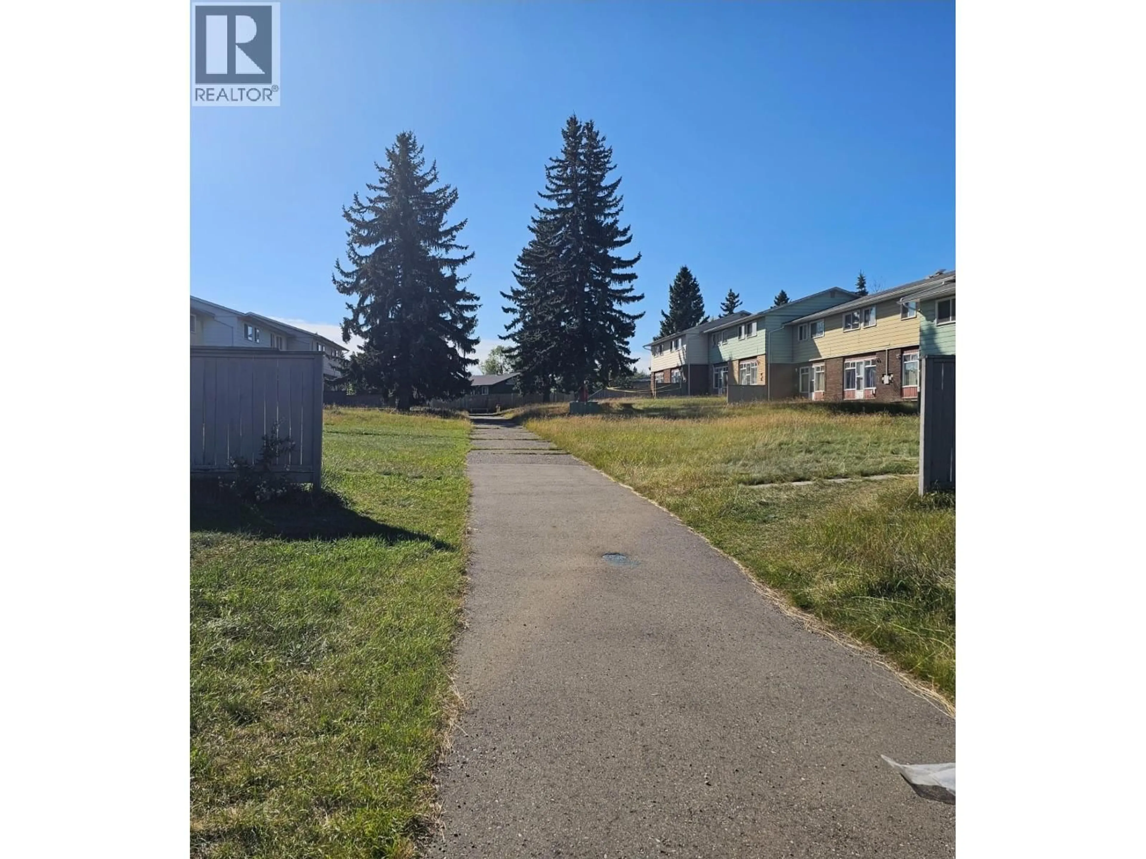 A pic from outside/outdoor area/front of a property/back of a property/a pic from drone, street for 138 - 4045 1ST AVENUE, Prince George British Columbia V2M4N3