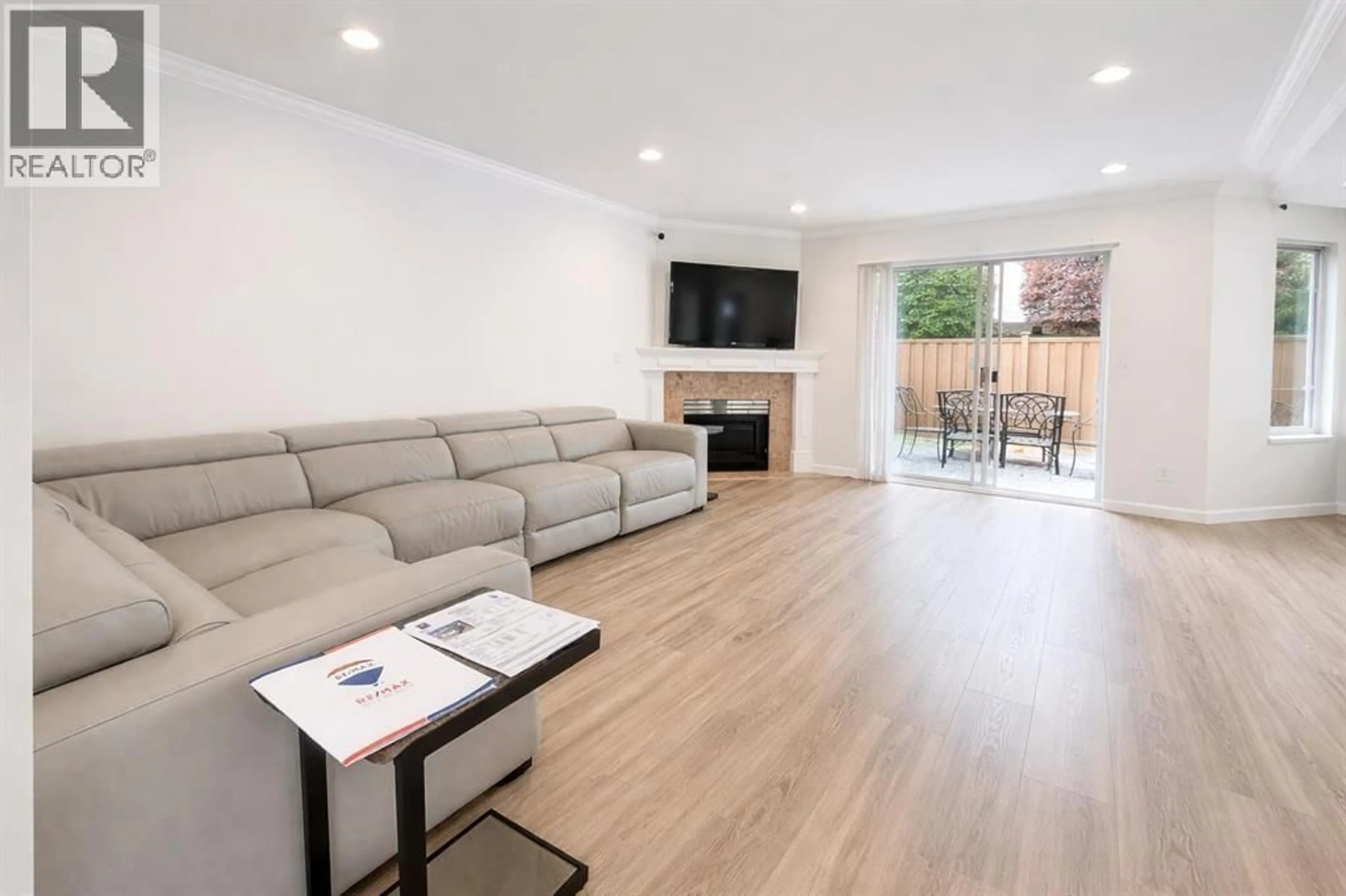 Living room with furniture, wood/laminate floor for 34 - 8051 ASH STREET, Richmond British Columbia V6Y3X6