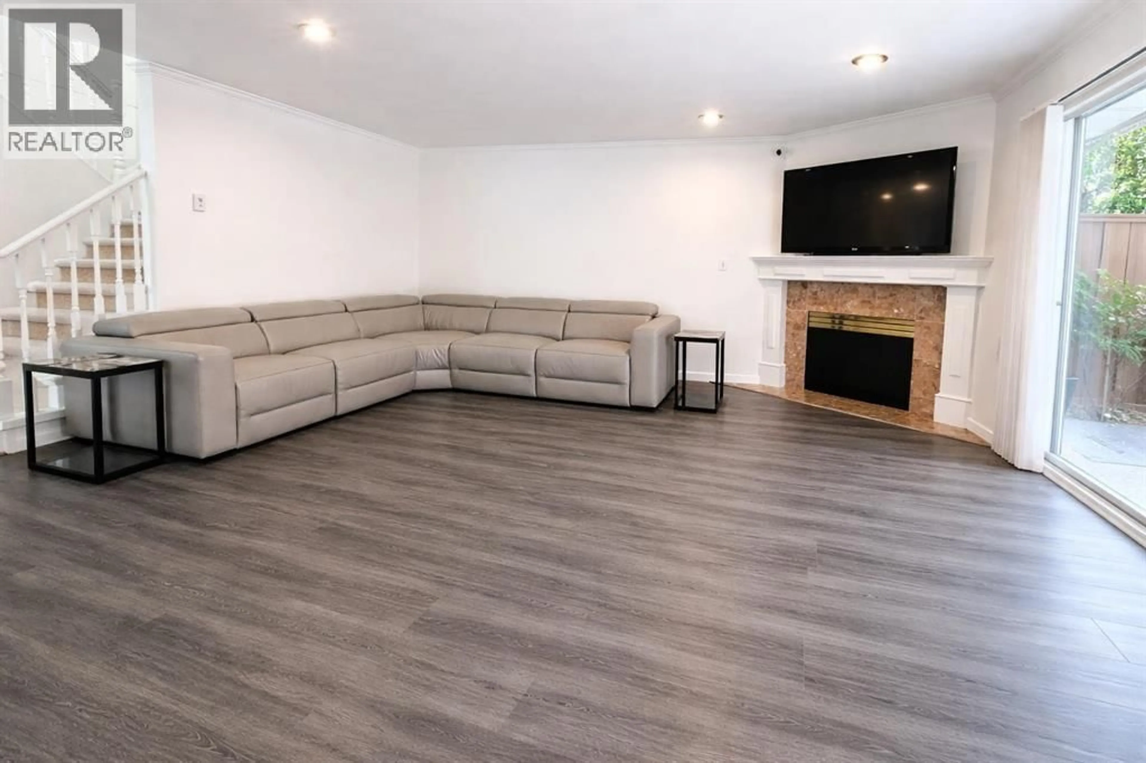 Living room with furniture, wood/laminate floor for 34 - 8051 ASH STREET, Richmond British Columbia V6Y3X6