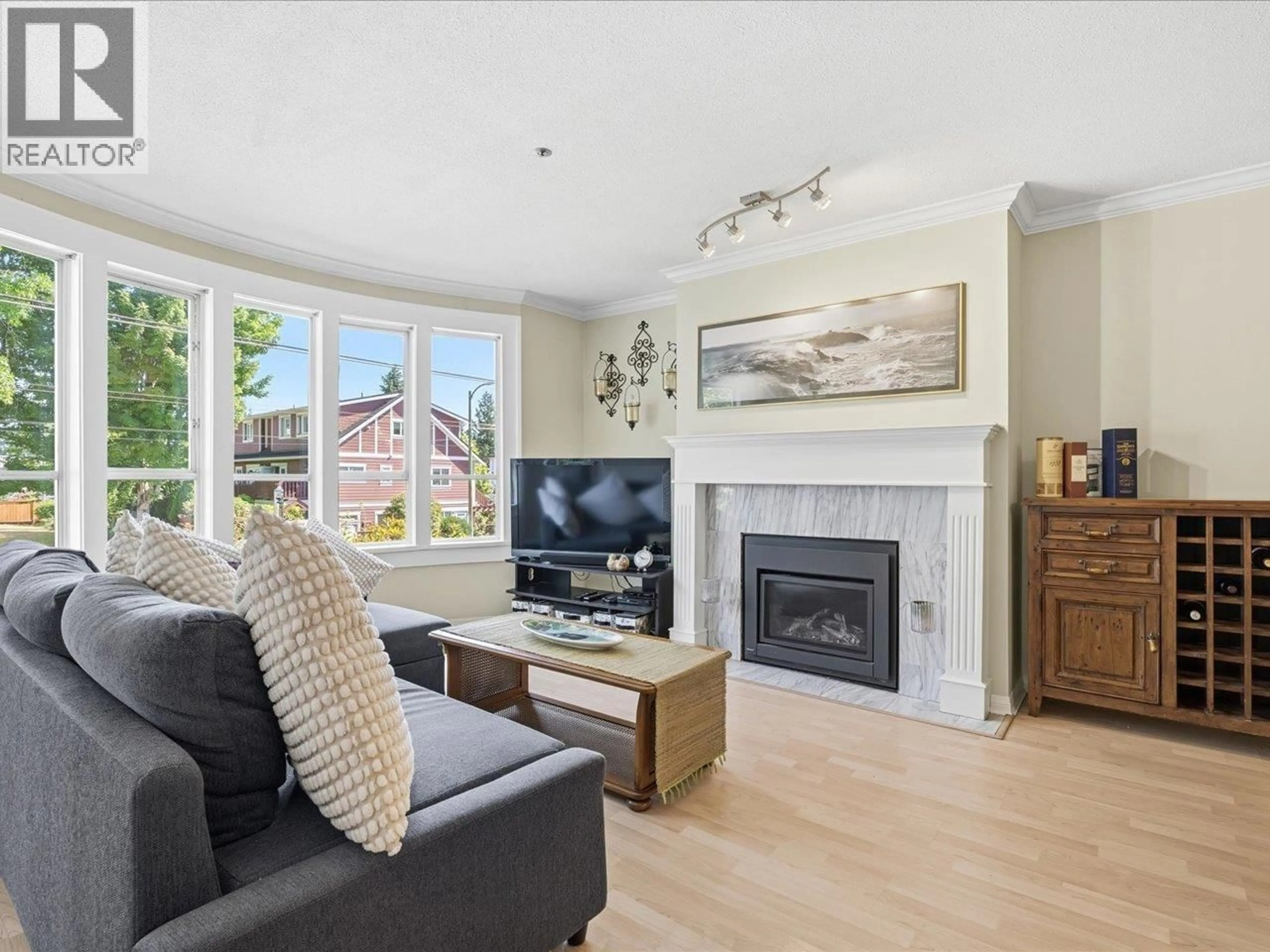 Living room with furniture, wood/laminate floor for 201 - 3220 4TH AVENUE, Vancouver British Columbia V6K1R9