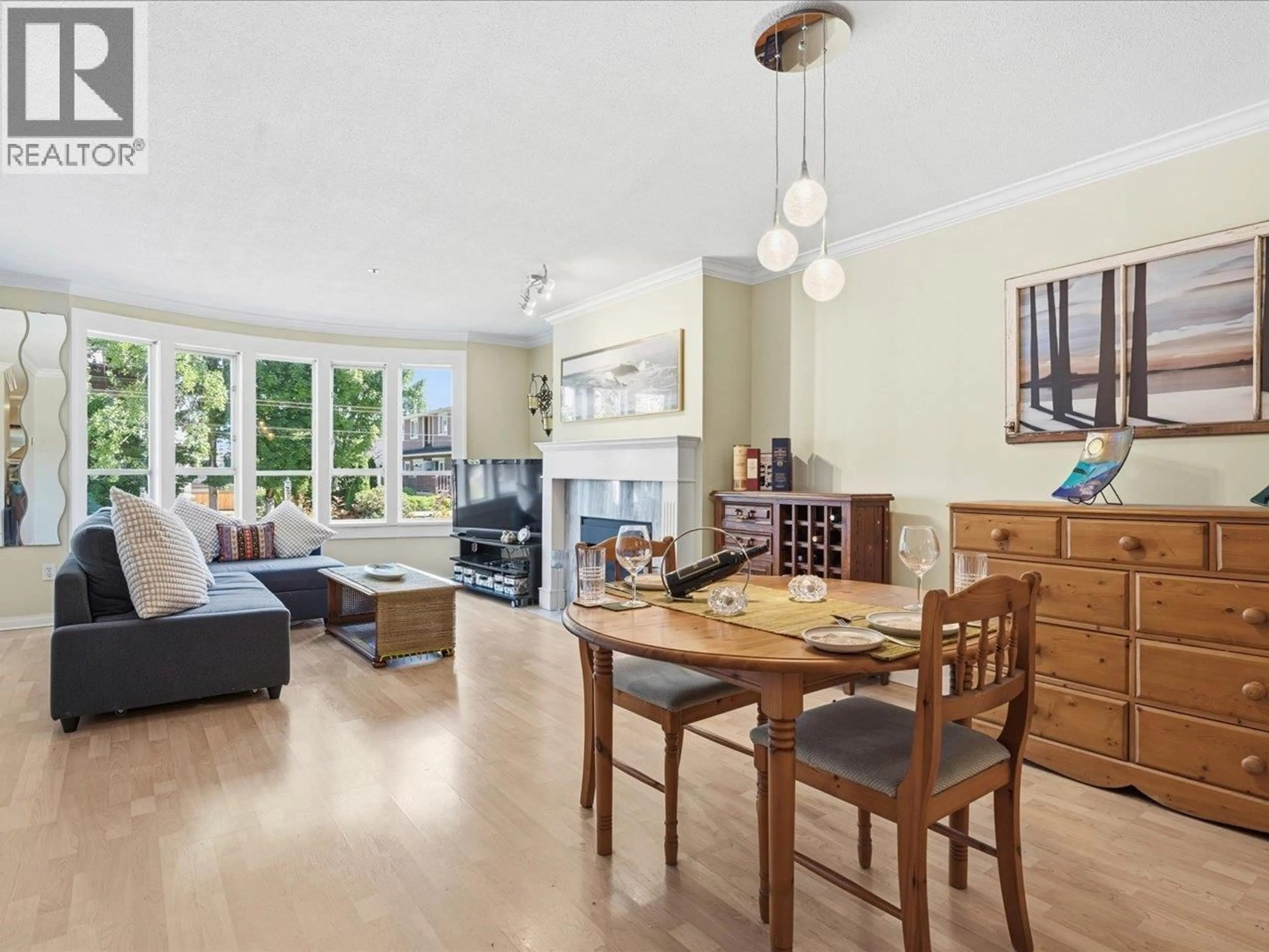 Living room with furniture, wood/laminate floor for 201 - 3220 4TH AVENUE, Vancouver British Columbia V6K1R9
