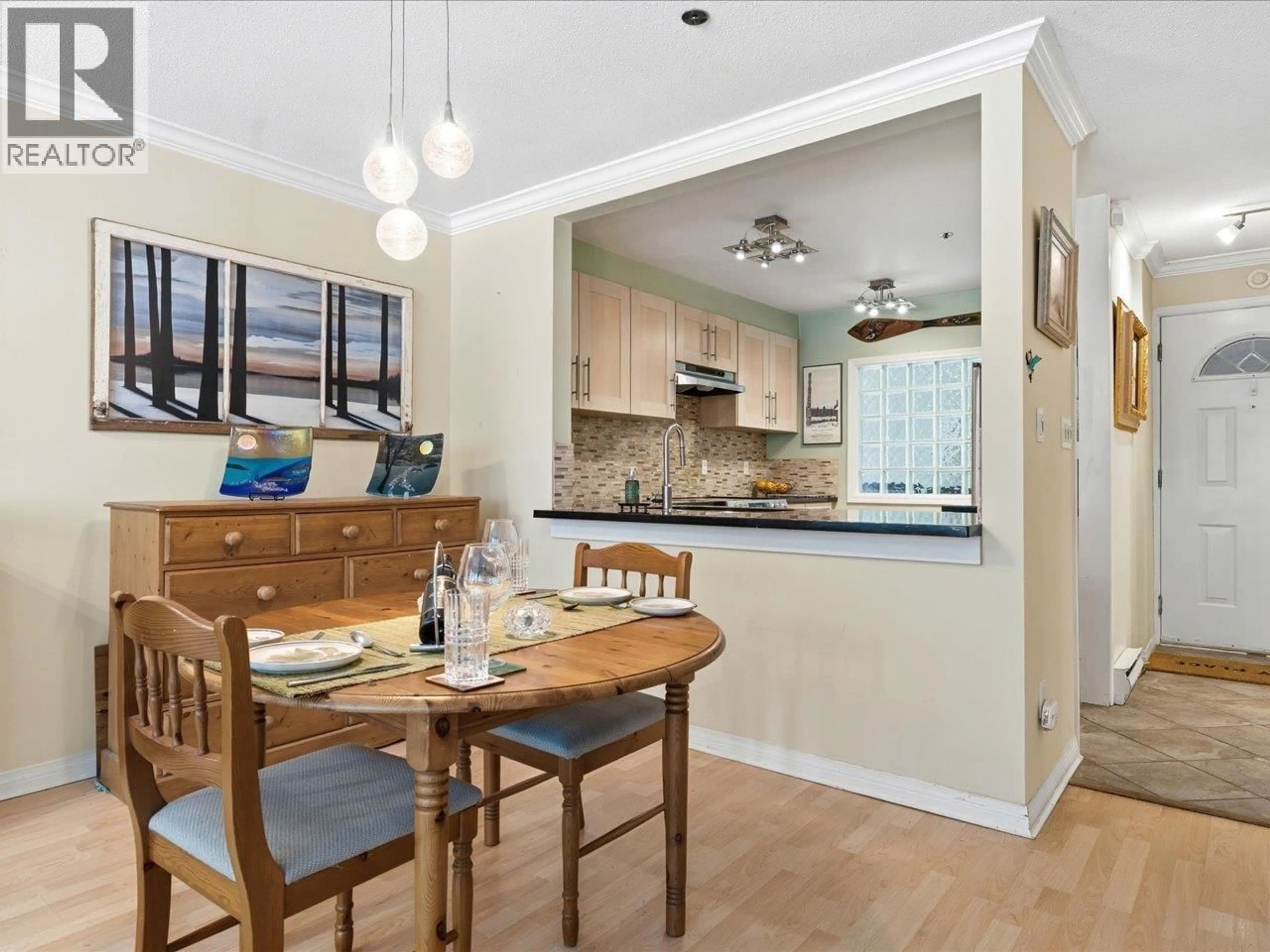 Open concept kitchen, wood/laminate floor for 201 - 3220 4TH AVENUE, Vancouver British Columbia V6K1R9