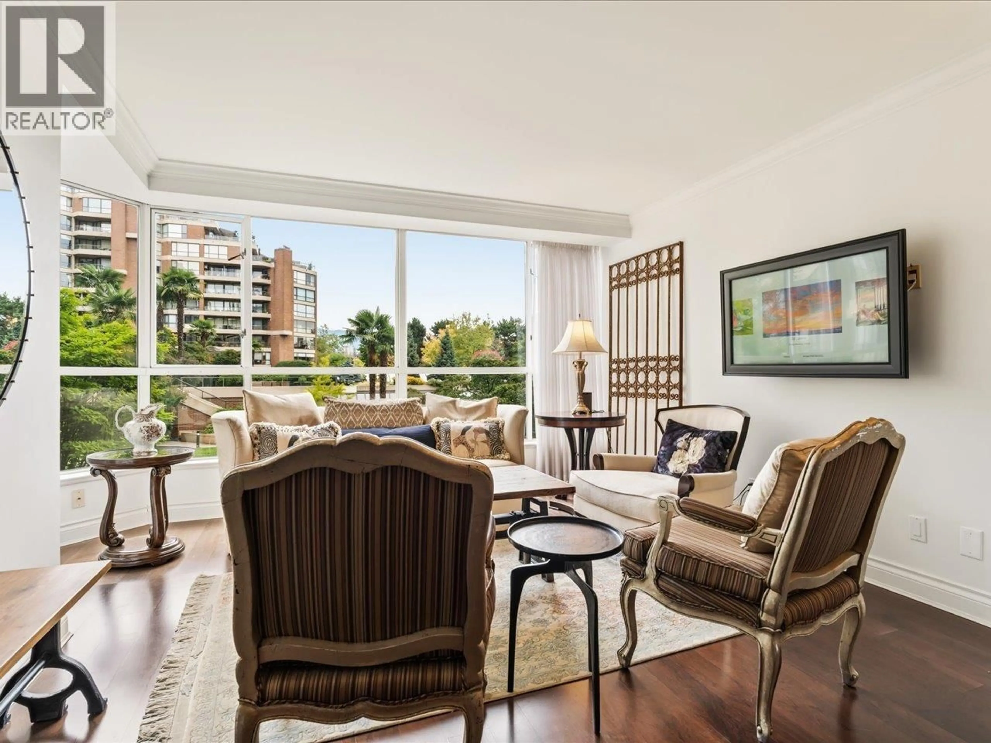 Living room with furniture, wood/laminate floor for 108 - 1490 PENNYFARTHING DRIVE, Vancouver British Columbia V6J4Z3