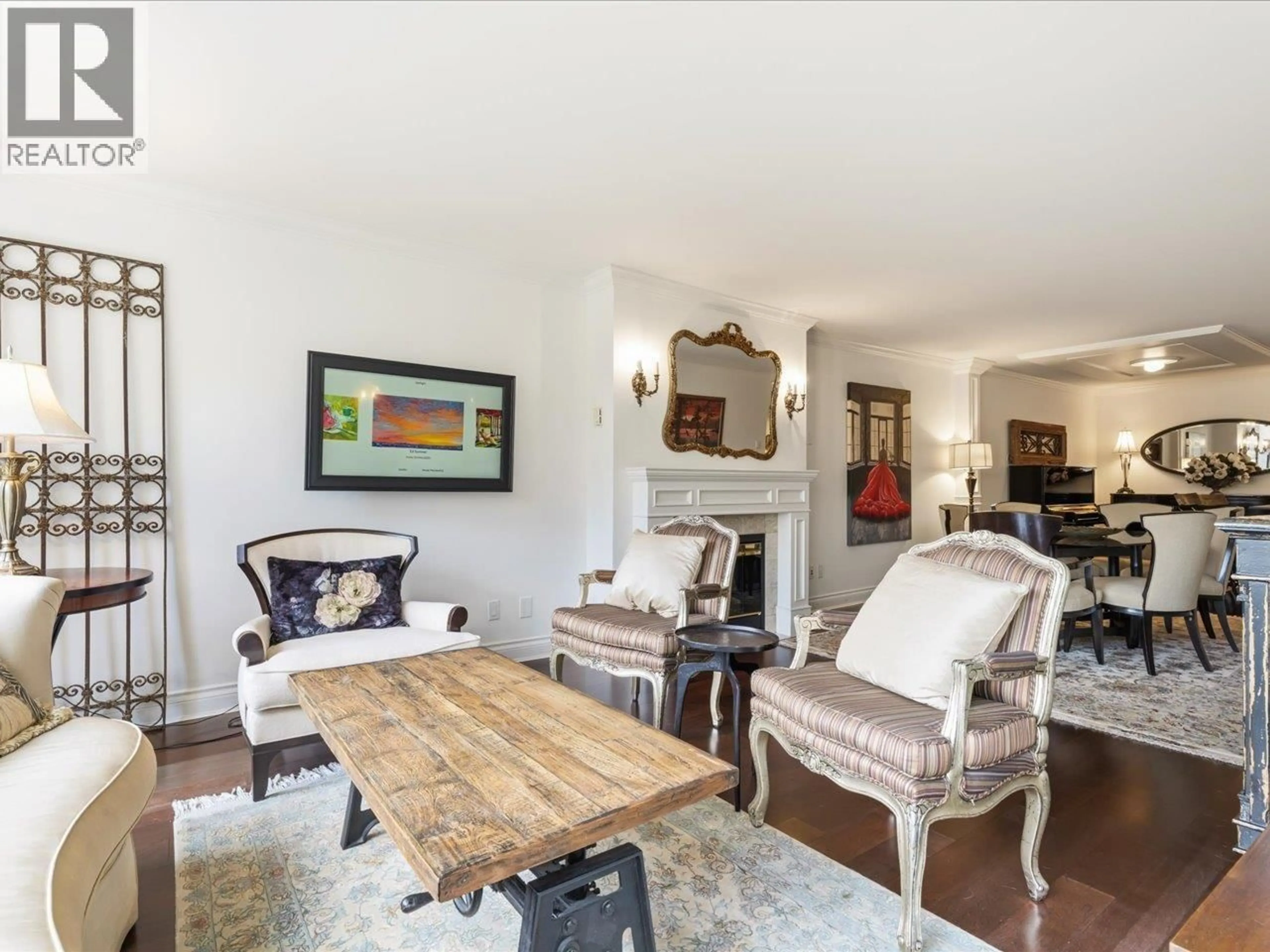 Living room with furniture, wood/laminate floor for 108 - 1490 PENNYFARTHING DRIVE, Vancouver British Columbia V6J4Z3